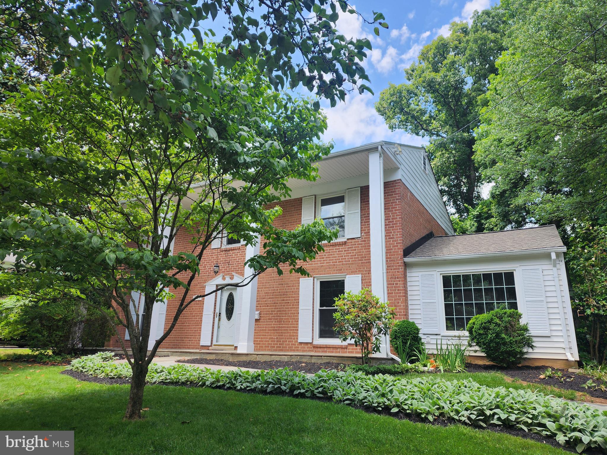 The section of Stratton Drive is delightfully retro - the kind of street where kids walk to school in clusters every morning and neighbors know each other's names. Tucked into Potomac Woods, one of Rockville's most sought-after neighborhoods, this handsome colonial sits just blocks from highly regarded Ritchie Park Elementary, on a tree-lined street with sidewalks, mature shade, and the unhurried feeling of a place that hasn't forgotten what a neighborhood is supposed to be.
The house delivers on every front. Steps from expansive Potomac Woods Park — baseball fields, playgrounds, tennis courts, walking paths — and minutes from Park Potomac's restaurants, Harris Teeter, and daily conveniences. Inside: an updated eat-in kitchen with stainless steel appliances and granite countertops, a brick fireplace in the family room, a show-stopping oversized living room with gleaming hardwood floors and generous windows, and a formal dining room sized for real entertaining. Upstairs, four generous bedrooms including a renovated primary suite with tiled shower and custom glass door. The hall bath features a double vanity, jetted tub, and custom tile. Downstairs, a huge rec room with new carpet and fresh paint, plus laundry and storage with real potential for future finished space.

Open Thursday 5–7 PM and Sunday 1–4 PM.
