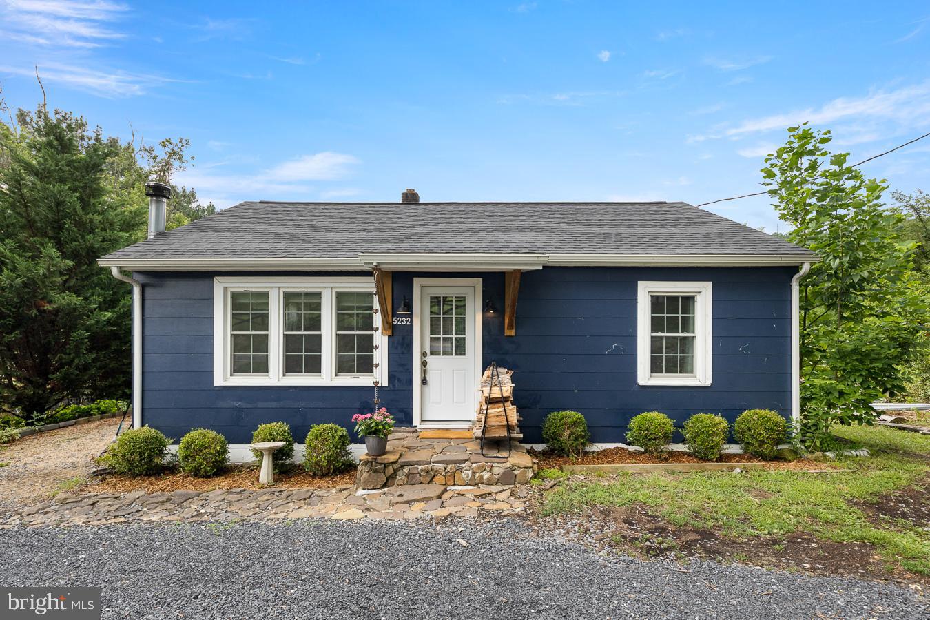 You don't want to miss the opportunity to see this homestead in the making! The home is filled with character and charm with 3 bedrooms, den, full bath, cozy Living Room with hand laid stone hearth for an enclosed freestanding woodstove. Home has hardwood floors and newer vinyl plank wood looking floors.  Country Kitchen with dining room.The roof has new shingles. Newly upgraded septic box and lines with cleanout. Multiple outbuildings on the property - a yard studio/clubhouse with loft and craft area.  Attached to the clubhouse is a bright and spacious greenhouse. The other outbuilding/shed gives you plenty of space for a workshop or storage.    Newer enclosed deck about 2 years old with screened porch, metal roof and Clay Chiminea Fireplace.   New sliding glass door, new back door, new front door and new windows in the front of the house.  Also worth noting the property has been well insulated.  The yard has multiple gardens, fruit-bearing plants, fenced enclosures for small animals - chickens, rabbits and goats, etc. - woodshed and a pavilion. Total of 1.5 acres and backs to a small intermittent spring at the rear of the property.  The property is close to BRYCE RESORT and Lake Laura.  DRIVEWAY DETAILS PLEASE NOTE!!  Drive past the house when coming from Mt. Jackson and turn around in the wooded area.  Then you want to turn in at the first driveway entrance look for a RED triangle sign hanging on a tree right before the driveway.  When leaving the driveway, it is best to roll your window down and listen for vehicles that may be approaching.
