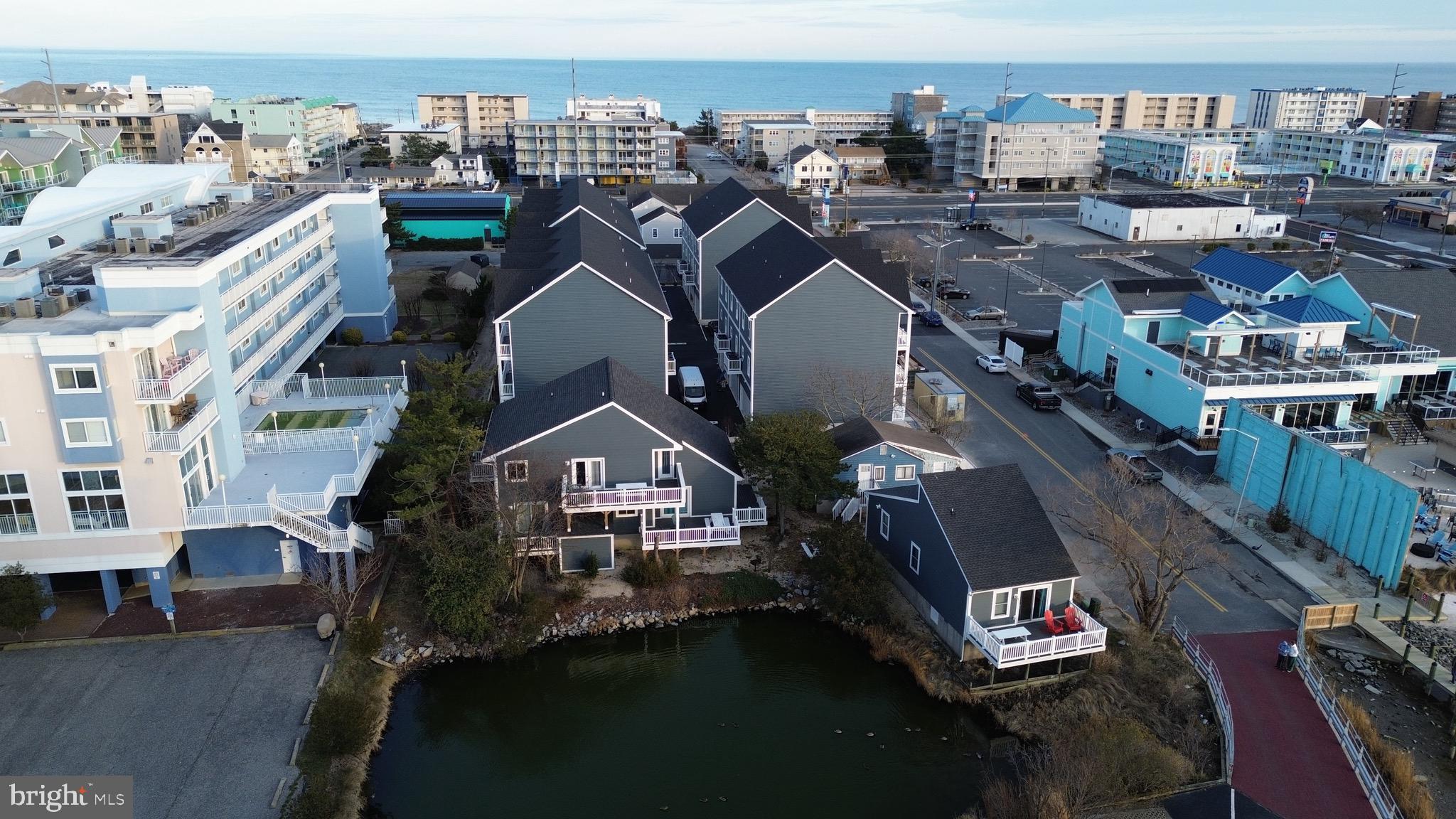 Huge Price Drop
This bayfront, income-producing multi-unit property on 75th Street in Ocean City, MD presents a rare opportunity to own a unique compound overlooking Assawoman Bay. Situated on two parcels, Tax ID #2410086868 and Tax ID #2410086841, the property includes three separate buildings offering exceptional water views from each structure and strong rental performance potential.

The complex consists of one two-bedroom house, two three-bedroom units, and one four-bedroom unit, totaling twelve bedrooms and nine full bathrooms. Each unit is designed to maximize views and functionality, creating an ideal setup for vacation rentals, multi-generational use, or a private waterfront retreat.

The property has been substantially improved with a new roof and new siding on two of the three buildings, raised foundations, extensive interior renovations, and the addition of a storage unit, making this a turnkey opportunity with reduced future capital needs.

Unit A offers three bedrooms and two bathrooms, sleeps up to ten guests, features central air conditioning, and showcases excellent bay views. Unit B includes two bedrooms and one bathroom with wall air conditioning and baseboard heat and presents a clear value-add opportunity for future redevelopment on the existing raised foundation. Unit C features a large updated kitchen, four spacious bedrooms, three full bathrooms, central air and heat, and expansive bay views, comfortably sleeping up to twelve guests. Unit D has been nicely updated with granite countertops, large bedrooms and bathrooms, three bedrooms and three full baths, central air conditioning, excellent water views, and sleeps up to ten.

All units are furnished in a coastal style and include laminate flooring, updated countertops, large flat-screen televisions, refrigerators, and microwaves. The property also features a community washer and dryer on site, an outdoor shower, on-site storage, and a large driveway with thirteen off-street parking spaces, allowing guests to park once and walk to nearby midtown shops, restaurants, and the beach.

Located just blocks from the ocean with direct bay access only steps away for paddleboarding or kayaking, this property delivers both the lifestyle renters seek and the income investors value. With large decks, stunning bay sunsets, and a flexible multi-building layout, this is a rare midtown Ocean City waterfront compound offering immediate income and long-term upside. Professional photos to follow.