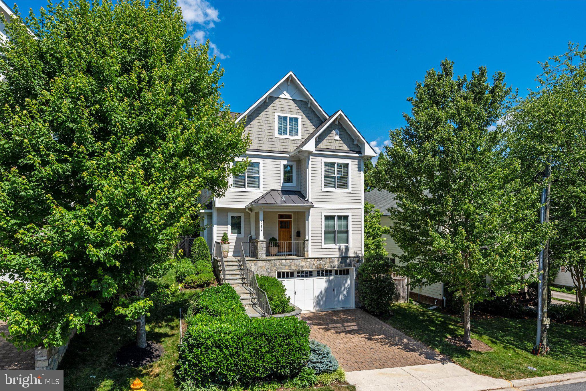 Dreaming of better-than-new construction in a super convenient North Arlington location?  Discover this quality-built residence located on a cul-de-sac near Washington Golf and Country Club, Donaldson Run Trail and Lee Heights shopping.  This property has been thoughtfully enhanced and meticulously maintained by its only owners.  You'll find a spacious and bright residence with a delightful plan that offers ample spaces to gather or to enjoy privately  - even at the same time.   Sited among lush professional landscaping (by Fine Earth Landscaping), the stone and Hardie Plank exteriors  promise ease of maintenance.  The first floor (9' ceilings)  with beautiful oak hardwood floors offers both traditional living and dining rooms along with open concept informal areas that include the family room with gas fireplace, informal dining and the superbly equipped kitchen with Sub-Zero, JennAir six-burner dual fuel range with double ovens and an electric griddle, granite counters, island and breakfast bar.  Cooks will also enjoy the ample pantry and convenient butler's pantry with granite counters and beverage refrigerator.  The patio is just a step away, where its automated awning invites outdoor enjoyment, whatever the weather.  The main stairway is wide and filled with natural light.  On the second floor (9' ceilings), you'll appreciate the generous primary suite with its soaring tray ceilings, spa-like bath and dressing room/closet that will inspire you.  Both roomy corner bedrooms offer a walk-in closet.  The cheerful  and convenient laundry room has a full size washer and dryer along with a sink, tile floor and window.  The top floor contains the fourth spacious bedroom, a full bathroom and a flexible space that might serve as a retreat or study.  The lower level will not disappoint, with its 8'8" ceilings, recreation room with gas fireplace, fifth bedroom (currently used as a home gym), full bath, utility room, mudroom with tile floor and custom built-in bench and coat hooks.   The oversize two-car garage offers ample customized storage.   Among the many upgrades is a whole house water filtration and softener system plus reverse osmosis filter in the kitchen.  Full list of upgrades available.  Please tour this impeccable property Saturday 1-3 PM or Sunday 2-4 PM.
