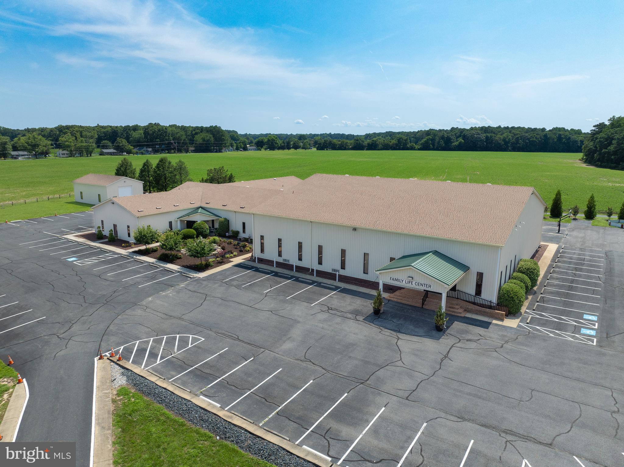 Rare Opportunity for an amazing Church facility. We are offering a unique opportunity on an 8.52-acre property currently utilized by Trinity Church. The main building, encompassing 24,908 square feet, features an inviting entryway, two distinct sanctuaries with the primary one accommodating up to 700 attendees including mezzanine seating, a built-in baptismal tub. The building has a  kitchen, multiple office spaces, and a youth hangout area. The property also includes a +/- 1,500 SF warehouse with a large bay door and a +/- 2,500 SF house. With 108 marked parking spaces and additional space for more, this property is perfectly suited for various uses and offers ample flexibility for prospective buyers or tenants.