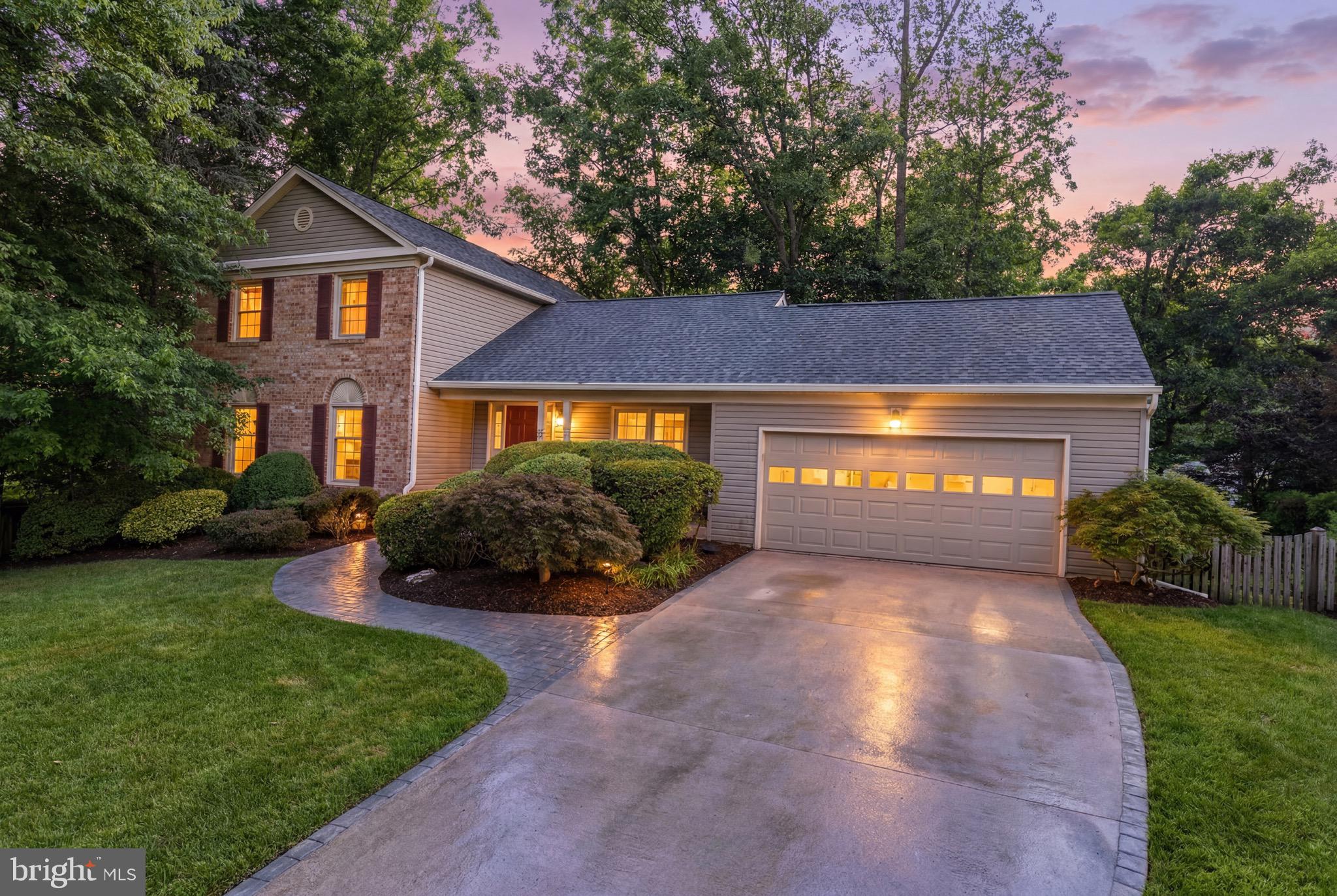 Welcome home to 6404 Phillip Court located in Kenwood Oaks, a hidden gem in the heart of West Springfield! This beautifully remodeled Marlborough model offers 5 bedrooms, 2 full & 2 half bathrooms, and over 3,300 total square feet across three finished levels, all sitting on a spacious 0.3194 acre lot with a 2-car garage plus driveway parking. The upper level features 4 bedrooms and 2 full bathrooms, a half bath is conveniently located on the main level, and the walk-out lower level offers a 5th bedroom and additional half bath, perfect for guests, extended family, or a private home office setup. Enjoy cozy evenings by the propane fireplace, or head outside to the front porch, back patio, and stone work for effortless indoor-outdoor living. Original owners have lovingly maintained and updated this home throughout the years. 2026 updates include freshly painted kitchen & laundry room cabinets, a fully remodeled primary bathroom, updated upper-level hall bath, new carpet throughout, fresh paint throughout, recessed lighting, new GFCIs, new water valves in the bathrooms, and new smoke detectors and ceiling fans. Additional updates: 2025 - roof, gutters & Trex deck. 2022 - water heater. 2020 - water softener. 2018 - HVAC. Community at its finest - Kenwood Oaks has no HOA and is connected to Hidden Pond Park with multiple wooded trails, and conveniently just a hop, skip, and a jump away from Springfield Golf & Country Club, Starbucks, Trader Joe's, Shopping, Yoga, Fitness Centers, Restaurants and so much more!