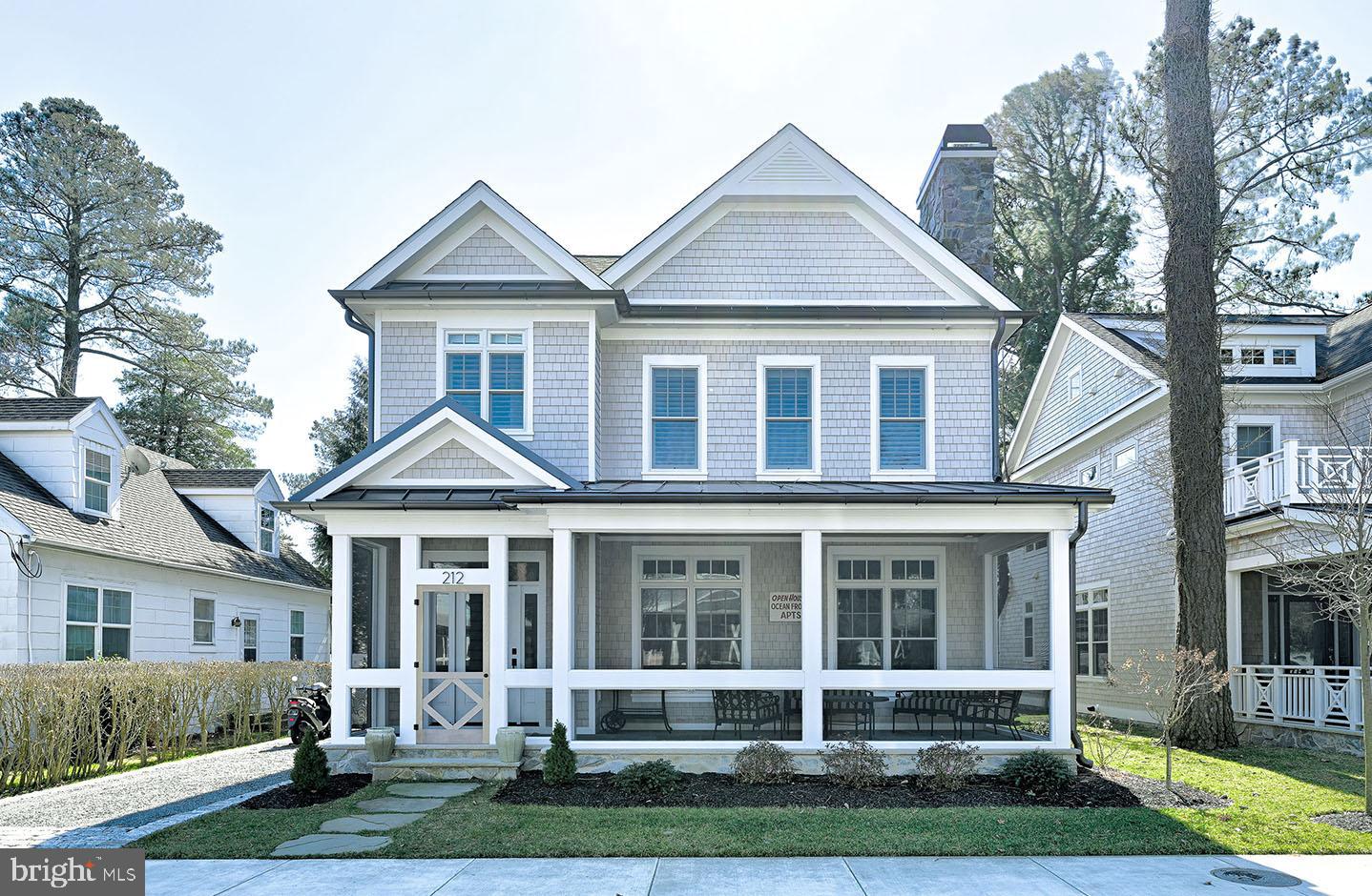 New construction custom home situated on one of South Rehoboth's most desired streets. Located just 3 blocks from the beach this stunning home is the ideal summer getaway, or year-round residence. Featuring 5 bedrooms, 5.5 baths, private en-suites in each bedroom, a sprawling open floor plan, light-filled gourmet kitchen, full basement, screened porch, and more. Upon entering you are greeted by a welcoming foyer with beautiful white oak hardwood flooring that continue throughout the home and lead to the living room which features a gas fireplace flanked by built-ins, and coffered ceilings. Open to the living room is a stunning gourmet kitchen with an oversized island, granite counters, Wolf appliance package including a 6-burner gas range, hood, French door refrigerator, drawer microwave, and Bosch dishwasher. Ideal for entertaining, the dining area is adjacent to the kitchen and features a dry bar with refrigeration. Other 1st floor features include a side entry, laundry room, and bedroom. Step upstairs to find 4 additional bedrooms each with high ceilings and spa-like tiled baths, and a 2nd floor sundeck. The exterior will include landscaping with irrigation, outside shower, basement access, and a shed for beach toys. Located steps from Rehoboth Avenue you will have easy access to a magnitude of highly-rated restaurants and boutiques plus access to the beach and boardwalk. Photos are of a similar home and available for showings.