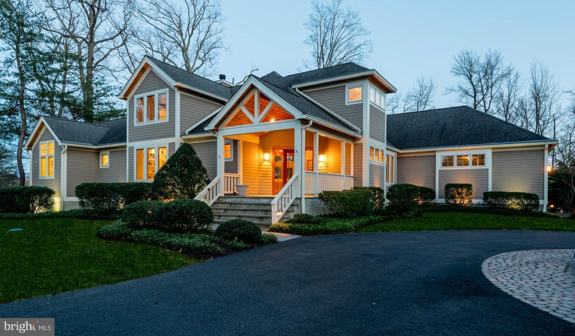 Stunning custom 4 BR|5 BA WATERFRONT w/wide views, 600' shoreline, 110' deepwater pier w/8'MLW all on 3+private acres & surrounded by 120 ac of protected park. Thoughtfully designed w/beautiful interior details, screened porch & deck overlooking paver patio, gated entrance, home theatre & main lev Master Suite. Superb location for boat enthusiasts located just 25 min to Annapolis & Baltimore.