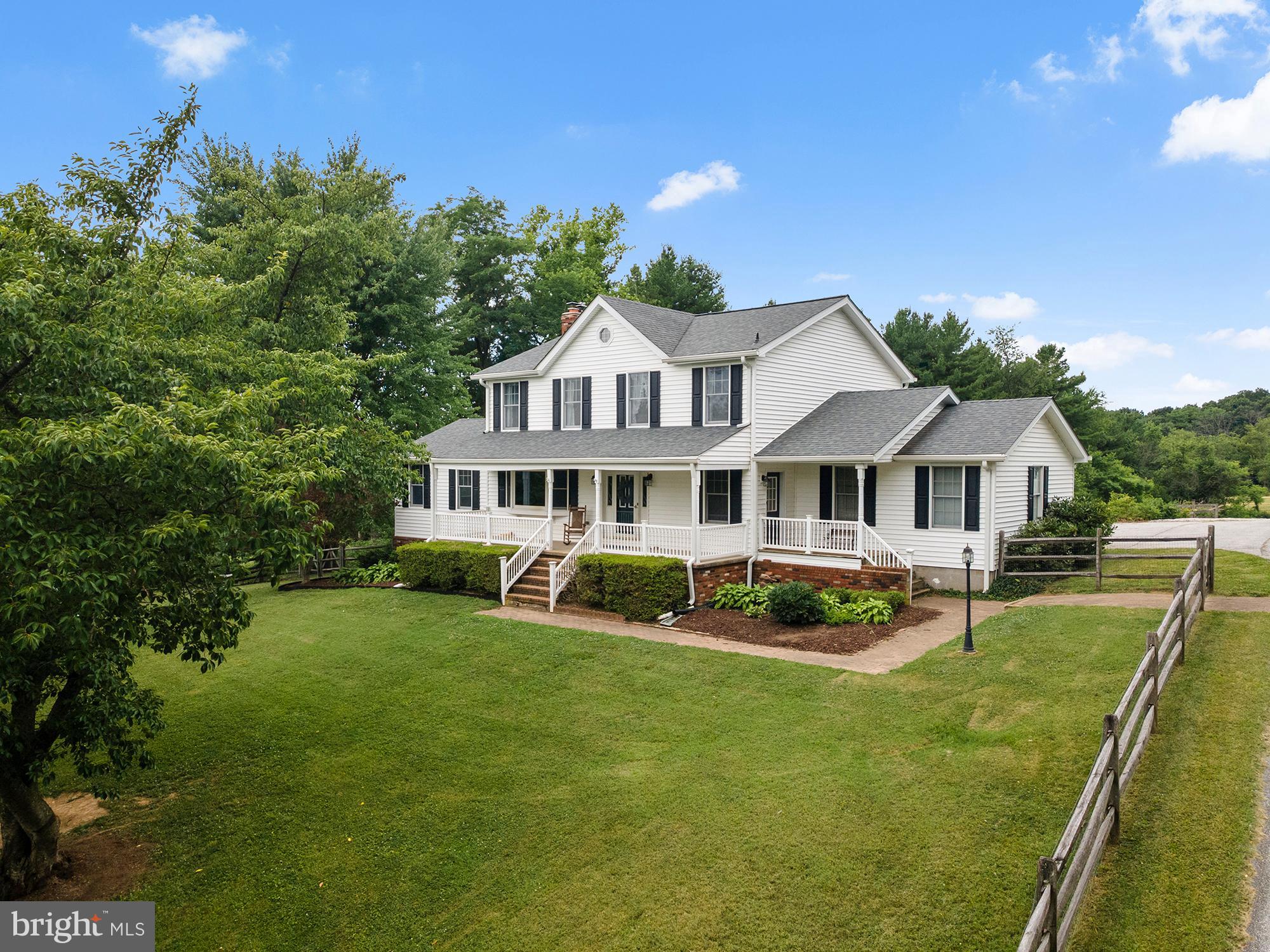 Your perfect rural homestead awaits at 1816 S Pleasant Valley Rd! The wonderfully updated colonial on just over 5 acres perfectly balances farmhouse charm with everything today's modern buyer desires. The spacious 4-5 bedroom, 3 full bath home is full of great spaces, features, upgrades, and amenities for the whole family. A newer roof and siding will provide peace of mind for years to come! A grand front porch spanning the front of the home greets you, and the rooms throughout the first floor are large, with hardwood flooring throughout, and warm and inviting while being functional. The large eat-in kitchen has been completely remodeled in the last 2 years, with a large island, two tone cabinetry, stainless appliances, so much room for table space and breakfast or desk nooks, an entryway/mudroom area, and access to your large, freshly redone back deck and 3 season room. The kitchen is always the heart of the home, and this space is no exception. There is a large sunken living room that anchors the entire west side of the home with beautiful hardwoods, windows, and a wood stove. There is also a full bath, large dining area, and office or potential bedroom to the front of the home. Upstairs, the wonderfully homey and large primary suite contains a sitting area, ample closet space, and an en-suite bath with walk-in glass door shower and dual vanities. There are 3 other sizeable bedrooms on the second floor and a freshly remodeled full bath off the hall that is bright, clean, modern, and has a tub/shower combination. The full basement provides plenty of useful space as a play area, workshop, or laundry, and could easily be finished for more designated living space. Outside, the perfect blend of amenities is waiting for the outdoor enthusiast, animal lover, gardener, or those simply wanting rural relaxing pool time! Multiple fenced paddocks provide space for livestock, and the center aisle barn has multiple stalls or can be used as a run-in. The property is bordered by trees and creates peace, seclusion, and a true feeling of being away from it all. Relax on the large back deck and overlook your animals and gardens. Sit on the front porch and take in the sweeping front yard with not a neighbor in sight. Meander through your pastures and find the balance between the hustle of every day life and the moments of solitude and quiet we work so hard for. The gardens, including vegetables and robust berry patches, have been cultivated over years and are perfect for continuing your produce production dreams or just getting started. Poultry, cows, horses, pigs, sheep, vegetables - this turn key farmette is the perfect canvas for country living. Quiet nights and appreciating everything the outdoors has to offer will become the cadence of your every day life, with a beautiful, functional, and spacious home becoming the backdrop for so many memories to be made.