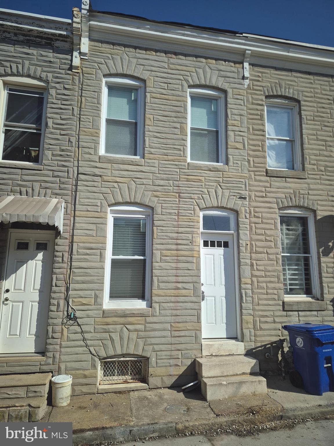 Great investment opportunity in Baltimore's Middle East neighborhood near Johns Hopkins Hospital. Seller will consider closing help with an acceptable offer. This turnkey 2-bedroom, 1.5-bath townhome features new flooring, drywall, paint, exposed brick, forced air heat, a 2017 water heater, and wood-style floors throughout. The main level offers living, dining, and kitchen spaces; the upper level includes two bedrooms and a full bath. The basement has open space, utilities, and a half bath. The property also boasts an enclosed backyard. No off-street parking; alley access only.