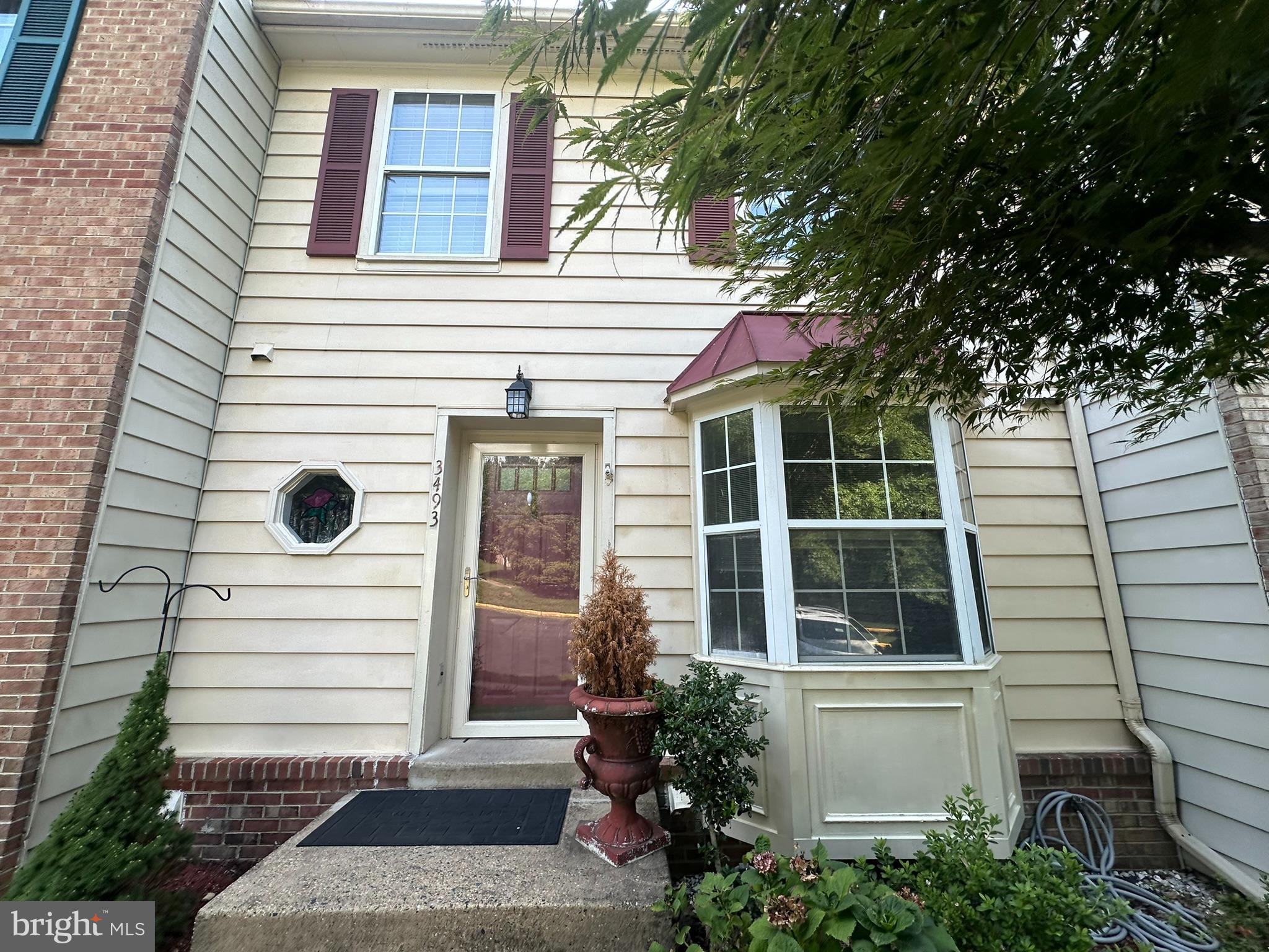Don't miss this opportunity to own a spacious townhouse in the sought-after Lake Ridge community. This home features 3 bedrooms, 2 full baths, and 2 half baths on 3 finished levels. The table-space kitchen has a bay window and plenty of cabinets. The living room/dining room combo has access to the deck overlooking the rear yard and trees. The primary bedroom has two closets and a private bath. Downstairs, the finished lower-level walks out to another deck and fenced yard. There is also a large rec room with a fireplace and a spacious utility/storage room. Perfectly located near local amenities and scenic walking trails, this home is ready for your personal touch!