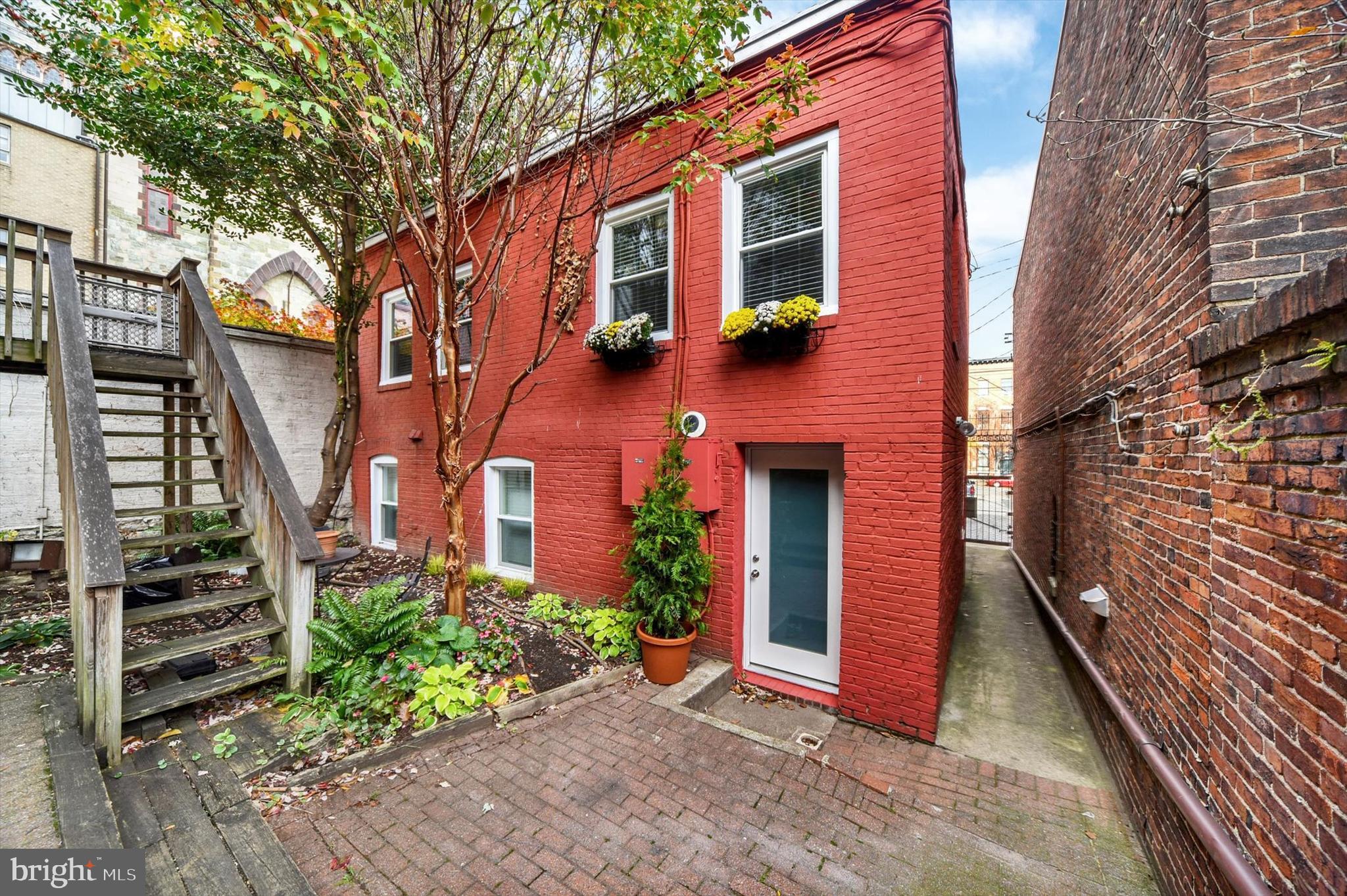 Rare opportunity to own a beautifully re-imagined two-level Carriage House condo in the heart of Mount Vernon—where historic charm meets modern living.

This 2-bedroom, 1.5-bath residence has been thoughtfully renovated to preserve its character while delivering today’s most desirable updates. The main level features a stunning brand-new kitchen, a convenient half bath, and an open, airy living space anchored by rich hardwood floors and a striking exposed brick accent wall—perfect for both everyday living and entertaining.

Upstairs, you’ll find two generously sized bedrooms with excellent closet space, along with a newly updated full bath. Skylights above the staircase flood the upper level with natural light, creating a warm and inviting atmosphere throughout.

Tucked away from the bustle, residents enjoy access to a private shared courtyard—an unexpected urban oasis ideal for relaxing or hosting.

Located just steps from the iconic Washington Monument and moments from major commuter routes including I-95 and I-83, this home offers the perfect blend of tranquility, style, and convenience.

A truly special opportunity to own a unique piece of Mount Vernon history.