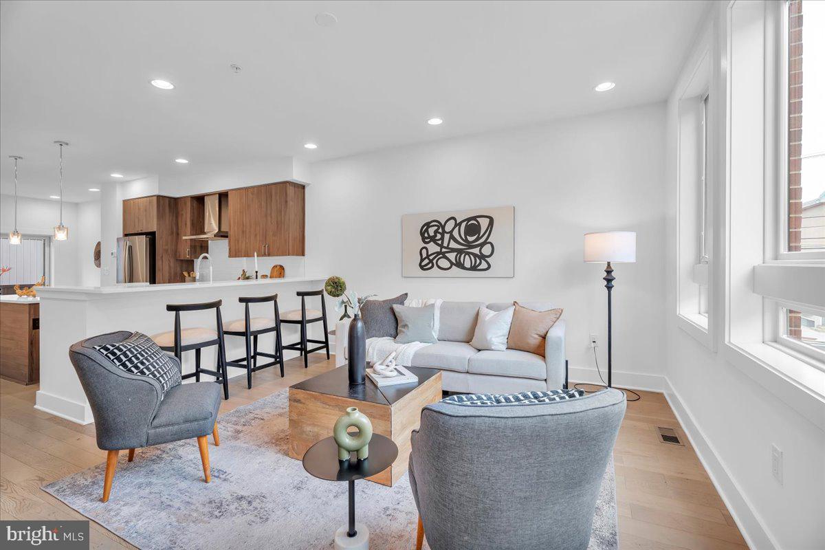 Welcome to The Quarters at Fairmount—a premier community in the heart of Northern Liberties. This 3 bed, 3.5 bathroom home comes equipped with a private garage and expansive roof deck. The main level showcases a beautiful kitchen complete with stainless steel appliances, custom cabinetry, and an open layout that flows seamlessly into the spacious living area ideal for entertaining or relaxing. Upstairs, you’ll find three generously sized bedrooms with ample closet space and large windows that flood each room with natural light. The top level leads to a private roof deck with sweeping skyline views. Residents also enjoy beautifully landscaped community gardens and shared outdoor spaces, all while being just minutes from public transportation, shopping, and some of the city’s best dining destinations. Taxes and square footage are the responsibility of the buyer to have verified independently.