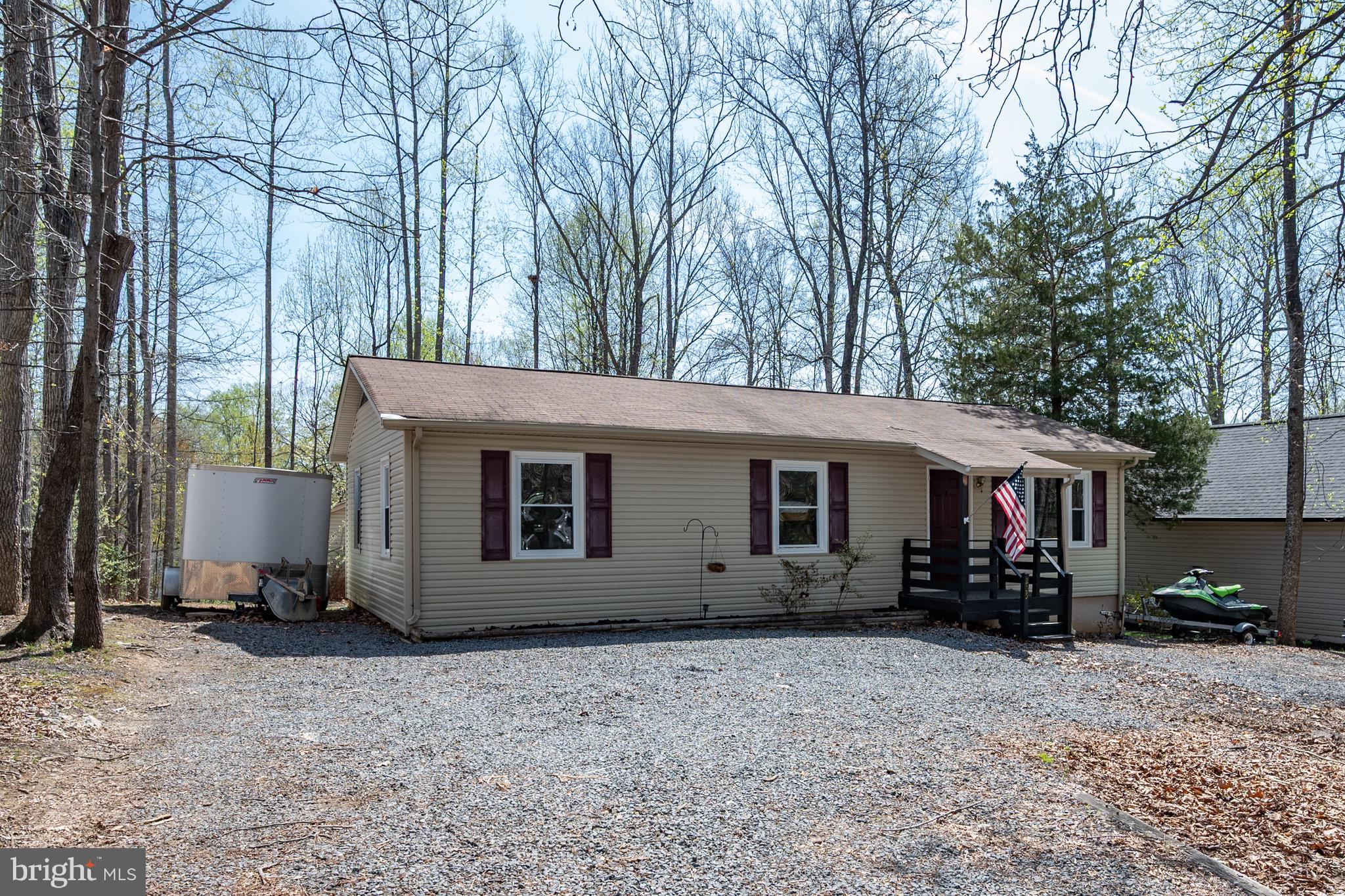 Move-in ready 3-bedroom, 1.5-bath rambler located in the highly desirable, gated Lake of the Woods community! This well-maintained home features numerous updates including a newer roof (2015), replacement windows (2013), updated siding, carpet, and paint. Spacious rooms throughout with a functional layout and main-level living.

Enjoy outdoor living on the back porch with convenient access from the kitchen and  laundry room. Large detached shed with power—perfect for a workshop or additional storage. Circular driveway provides ample parking for multiple vehicles.

Situated just steps from Cornwallis Beach with partial lake views, this home offers the perfect blend of comfort and lifestyle. Lake of the Woods amenities include lake access, beaches, pools, golf course, equestrian center, dining, and more—all within a short drive to Fredericksburg and Culpeper.