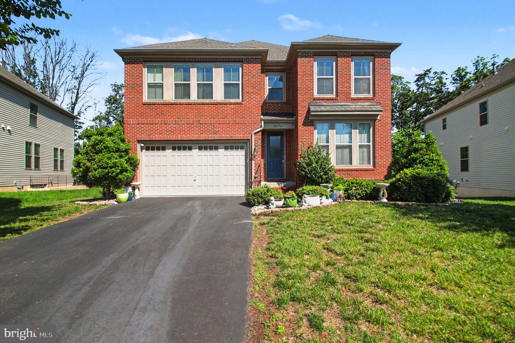 This exceptionally well-maintained brick-front home in the highly sought-after Eastview at Stone Ridge community offers 6 bedrooms, 5 full baths, and one of the largest floor plans in the neighborhood, boasting over 4,400 square feet of living space across three finished levels, plus a 380-square-foot front-loading attached two-car garage.

Nearly every detail in this home has been thoughtfully upgraded, with the seller investing over $150,000 for upgrades, premium finishes and enhancements. Gleaming hardwood floors flow throughout the main level, creating a warm and elegant atmosphere. A main-level bedroom and full bath provide the perfect setup for guests, multigenerational living, or a private home office. The open-concept layout features a spacious living area with a cozy gas fireplace and a formal dining room ideal for entertaining.

The gourmet kitchen is beautifully appointed with upgraded quartz countertops, designer backsplash, stainless steel appliances, a gas cooktop, double wall ovens, an oversized center island, abundant cabinetry, a pantry, and a  breakfast area. A stunning designer chandelier above the dining area and custom-made window treatments add the perfect finishing touches and enhance the home’s luxurious feel. If quality craftsmanship, attention to detail, and sophisticated design are important to you, this is a home you’ll truly fall in love with.

The thoughtfully designed mudroom offers ample space for a bench and everyday storage, making organization effortless. Upstairs, you’ll find four spacious bedrooms and three full baths. The luxurious primary suite features a tray ceiling, ceiling fan, generous walk-in closets, and a spa-inspired bath with dual vanities, a soaking tub, and a separate shower. The suite is spacious enough to accommodate a comfortable sitting area near the electric fireplace, creating a private retreat.

The fully finished lower level is perfect for entertaining and relaxing, featuring a large recreation room with a built-in electric fireplace, space for a dining or game table, a wet bar area, an additional bedroom, and a full bath. Walk-up stairs provide convenient access to the backyard.   Outside, enjoy a lush green lawn with a storage shed tucked neatly in the corner for lawn equipment and gardening tools, all backing to a serene wooded area for added privacy and natural beauty.

Enjoy an impressive array of community amenities, including a clubhouse, fitness center, three swimming pools, tennis courts, basketball courts, tot lots, and scenic walking trails.
This beautiful home offers the perfect balance of luxury, comfort, and community living, all conveniently located near major commuter routes, shopping, dining, entertainment, fitness centers, and movie theaters.