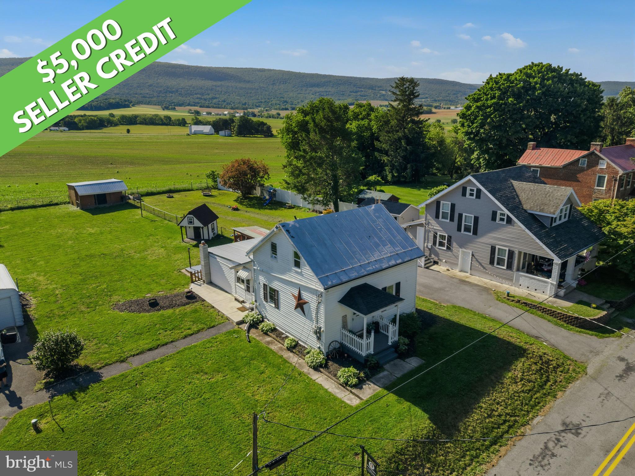 $5,000 Seller Credit with Full-Price Offer PLUS up to $10,000 in down payment and closing cost assistance for qualified buyers! Enjoy Smithsburg schools, county taxes, and Hagerstown convenience, with Whitetail Resort, Frederick, Gettysburg, and Chambersburg all within 30 minutes. This charming circa-1910 home offers mountain views, a level yard with room for chickens or goats, a covered outdoor living space, an oversized garage with its own electric panel, and an additional outbuilding. Major updates include a new heating system, whole-house water filtration and softener, metal roof sealed in 2023, and 220-amp electric. High-speed internet available. Priced to leave room for your personal touches. Ask your agent for the full updates list and Maryland Mortgage Program eligibility details.