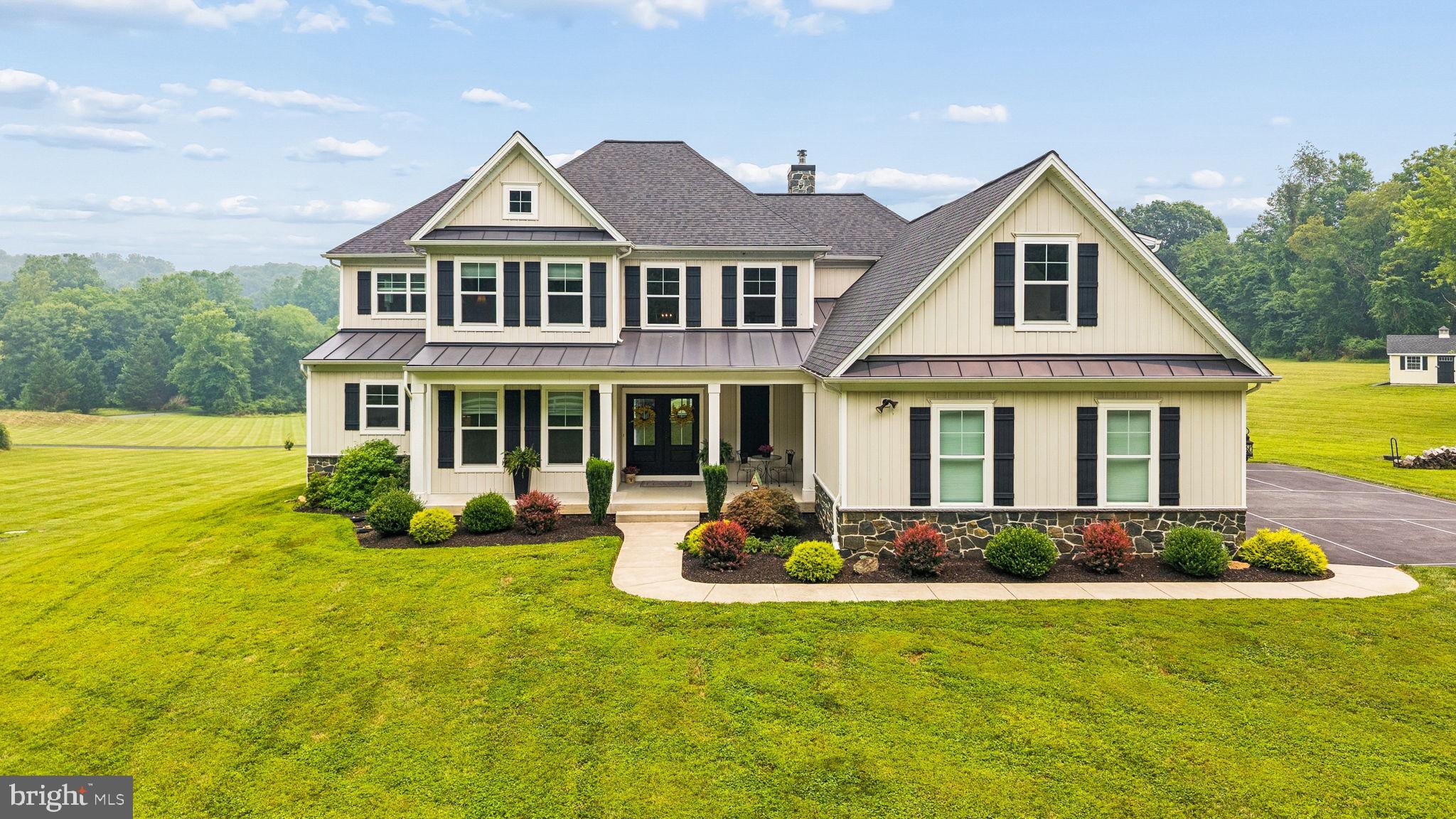 Rarely does a home check so many of today's buyers' wish lists! Conveniently located just minutes from I-83, this stunning 6 year young custom home offers modern finishes and an open floor plan on 3+ beautiful acres! The main level primary suite features a vaulted ceiling with wood beam accents, a luxurious bath and dual walk-in closets.  
The heart of the home is the impressive family room with coffered ceiling, shiplap fireplace, custom built-ins - all open to the expansive kitchen with abundant cabinetry and large center island.  Working from home? Enjoy the main level office with front yard views and French doors for privacy.
Upstairs you'll find three additional bedrooms, three full bathrooms and a spacious bonus room, providing exceptional flexibility for family and guests. 18207 Bunker Hill Road has an unbeatable combination of location, land and luxury making this home truly one of a kind!
