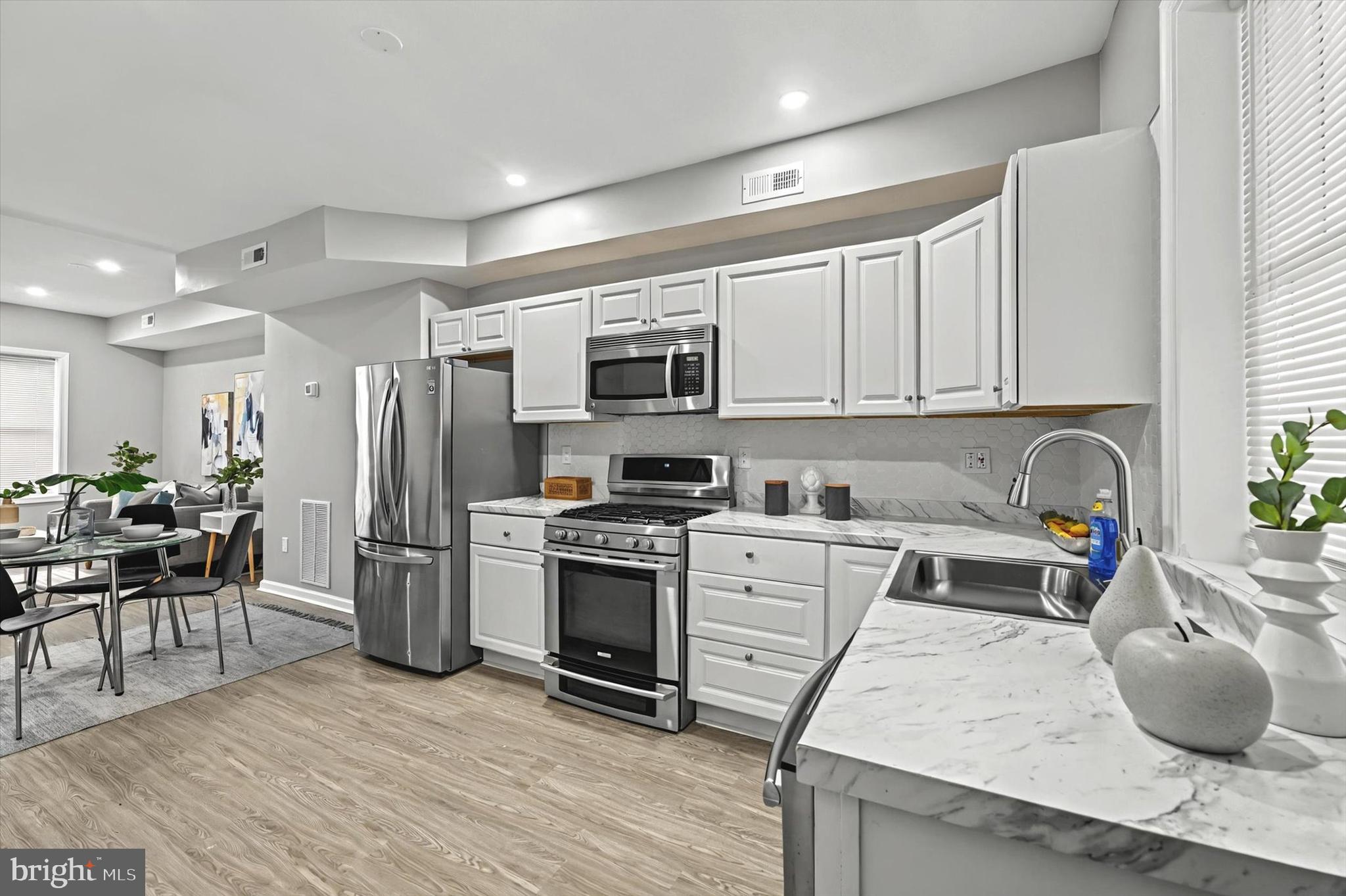 This beautifully renovated 4-bedroom, 2-bath townhome offers modern living at its finest. Boasting a spacious open layout, the home features sleek stainless steel appliances in the updated kitchen, perfect for both cooking and entertaining. The stylish design extends throughout the entire home, with contemporary finishes and ample natural light. With plenty of room for families or guests, this townhome provides comfort and convenience in a prime location. Move-in ready and designed for modern living, it's a must-see!