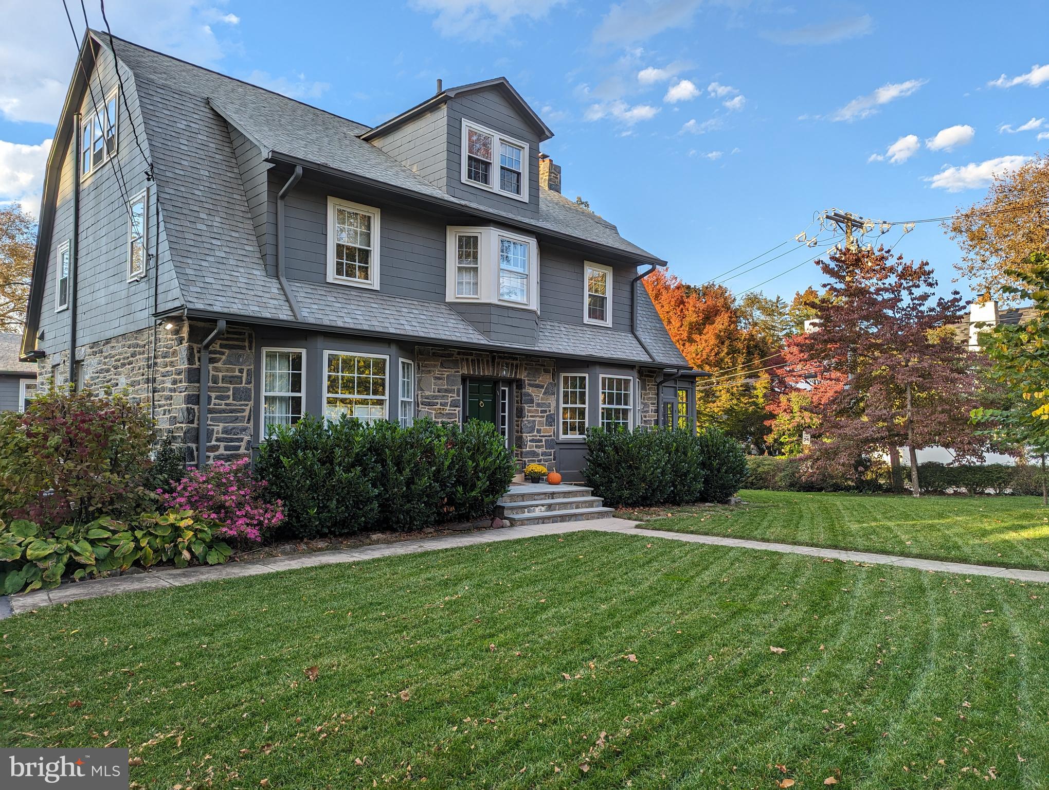 Very well-maintained stone & shingle home just a block from Merion Elementary School.  Lovely and peaceful rear yard surrounded by mature plantings.  House also has a dog run!  Center Hall Dutch Colonial has many replacement windows , updated bathrooms and newer Kitchen.  First Floor has 9 ft ceilings and the Sunroom has 9 1/2 foot ceilings.  The second floor has 8 ft ceilings and the third has 7 ft ceilings. 
 Lots  of Closet Space.  Third floor has two bedrooms, Hall Bath, large storage room (used once as a bedroom) and a small office.  Garage with 2 bays and a floored walk up that is unfinished.  Short distance to popular Downtown Narberth with commuter train, playground, shops and restaurants. Agent is related to Seller