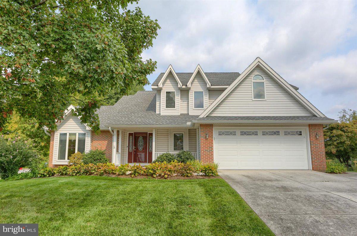 Gorgeous, move-in ready home on corner lot in Green Lane Manor!  The first floor's open floor plan easily lends itself to endless entertaining possibilities and plenty of room for family and friends.  A two story foyer with split staircase leads into the living room with its vaulted ceiling and floor to ceiling windows.  Walking through the dining room you will arrive at a gourmet kitchen that is a chef's dream!  With endless custom cabinets, crown molding, a built-in pantry, oversized granite countertops, soft close drawers and a double oven, the kitchen is the centerpiece of this home.  The family room features a raised brick gas fireplace flanked by built-in shelving.  Powder room with granite countertop and laundry room with utility sink complete the main floor.  Upstairs you will find four spacious bedrooms, each with a ceiling fan.  The primary bedroom and ensuite bath will not disappoint!  A walk-in closet, soaking tub, double sinks and separate stall shower allow for privacy and convenience.  Three additional bedrooms and a full hall bath with tub shower provide ample space for everyone.  This home's exterior lives up to the beauty of the interior.  An oversized deck leads down onto a wonderful patio and a garden filled with tomatoes, coneflowers and marigolds.  The privacy of this corner lot in a fantastic pedestrian neighborhood is a rare find in the area.  This is the home you have been looking for, do not hesitate to schedule a private showing today!