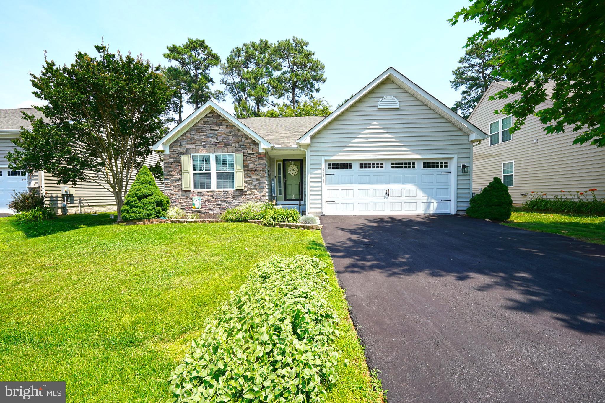 WELCOME TO THE WOODED PICTURESQUE COMMUNITY OF LONG NECK SHORES! This move-in-ready, single-floor home is a great value that you don't want to miss! It features a much-desired open floor plan with vaulted ceilings and a spacious & stylish kitchen with painted cabinets, stainless steel appliances and solid surface quartz countertops. The kitchen is central to the living and dining room areas. Natural light abounds throughout the house. Crown molding has been added and the house is freshly painted.
There are 3 large bedrooms. The primary suite, which includes a walk-in closet & an en-suite bath, along with two guest bedrooms, provides great living quarters for everyone. The vanities, toilets, lights and mirrors have been updated. 
A private backyard and a large deck complete the great outdoor space that is perfect for relaxation or entertaining. Extra heavy duty posts were added to accommodate a screen or 4 season room. New front steps and sidewalk were added. Mature landscaping and trees enhance the curb appeal. Gutter guards have been added for less maintenance.  The HVAC was new in 2020 and the Water Heater was new in 2025. The garage offers fresh paint, shelving, new electric receptacles, and storage racks. 
In Long Neck Shores, you will feel right at home featuring walking paths including extensive landscaping, a footbridge & gazebo, a community clubhouse, pickle ball courts with a fitness center, and an outdoor pool! All of this & more within minutes of shopping, dining, and the beaches! You will not want to miss this one. Call Today!