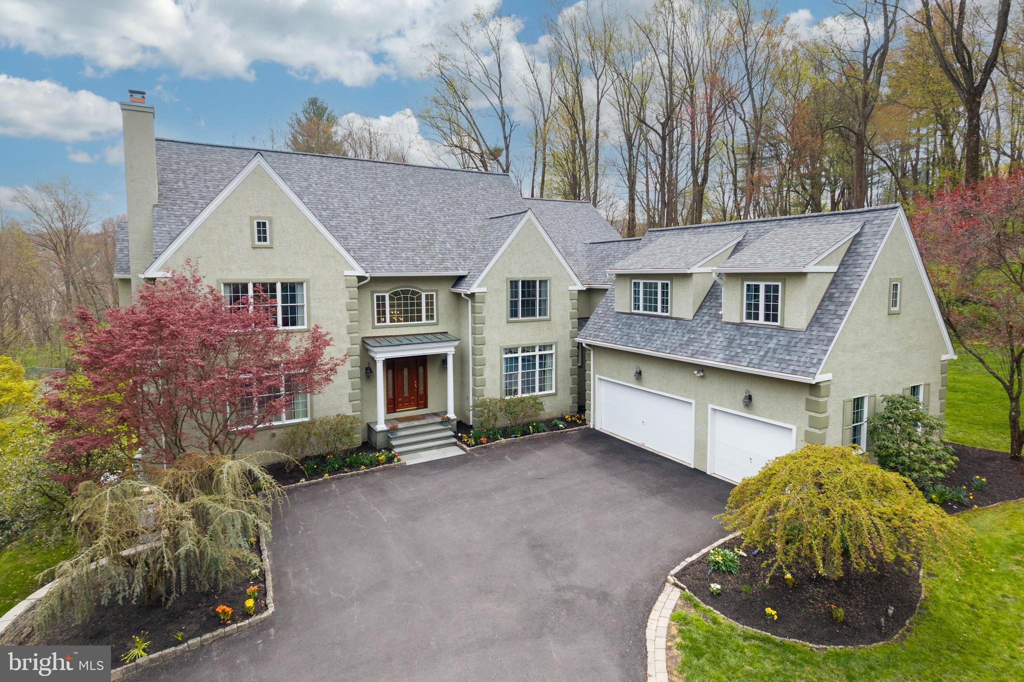 Welcome to 1200 Winderly Lane in Edgemont Township, Newtown Square. This stunning estate home sits on a private 2.36 acre wooded lot and offers 5 bedrooms, 4 full bathrooms, and 3 half bathrooms—perfect for comfortable living and elegant entertaining.
A grand foyer opens to a spacious formal living room with fireplace and a large dining room. The sun-filled family room features a vaulted ceiling and gas fireplace, creating a warm and inviting space. The eat-in kitchen is ideal for everyday living and entertaining, complete with a large gas range, center island with seating, and easy access to a walk-in pantry. Just off the kitchen, you’ll find a convenient first-floor laundry room with access to the 3-car garage and backyard. A private home office with its own balcony provides a quiet and functional workspace. Two half bathrooms are conveniently located on the first floor.
Upstairs, the home offers 5 generously sized bedrooms and 4 full bathrooms. The primary suite features a large soaking tub, separate glass shower, and a walk-in closet with built-ins. Two bedrooms have en-suite bathrooms, while a Jack and Jill bath connects the remaining bedrooms.  All bedrooms have hardwood flooring and ample closet space. 
The finished walkout basement adds valuable living space and includes a dedicated home theater—perfect for entertaining or relaxing.  The basement also includes a private flex room, a half bathroom, generous storage space and a cedar closet.
Outdoor living is just as impressive with an expansive deck overlooking peaceful wooded views. The property also features raised garden beds with a drip irrigation system, ready for planting. A new roof was installed in 2024.
Located in a prime location within the Rose Tree Media School District, this exceptional home offers space, privacy, and timeless appeal in one of Newtown Square’s most desirable settings.