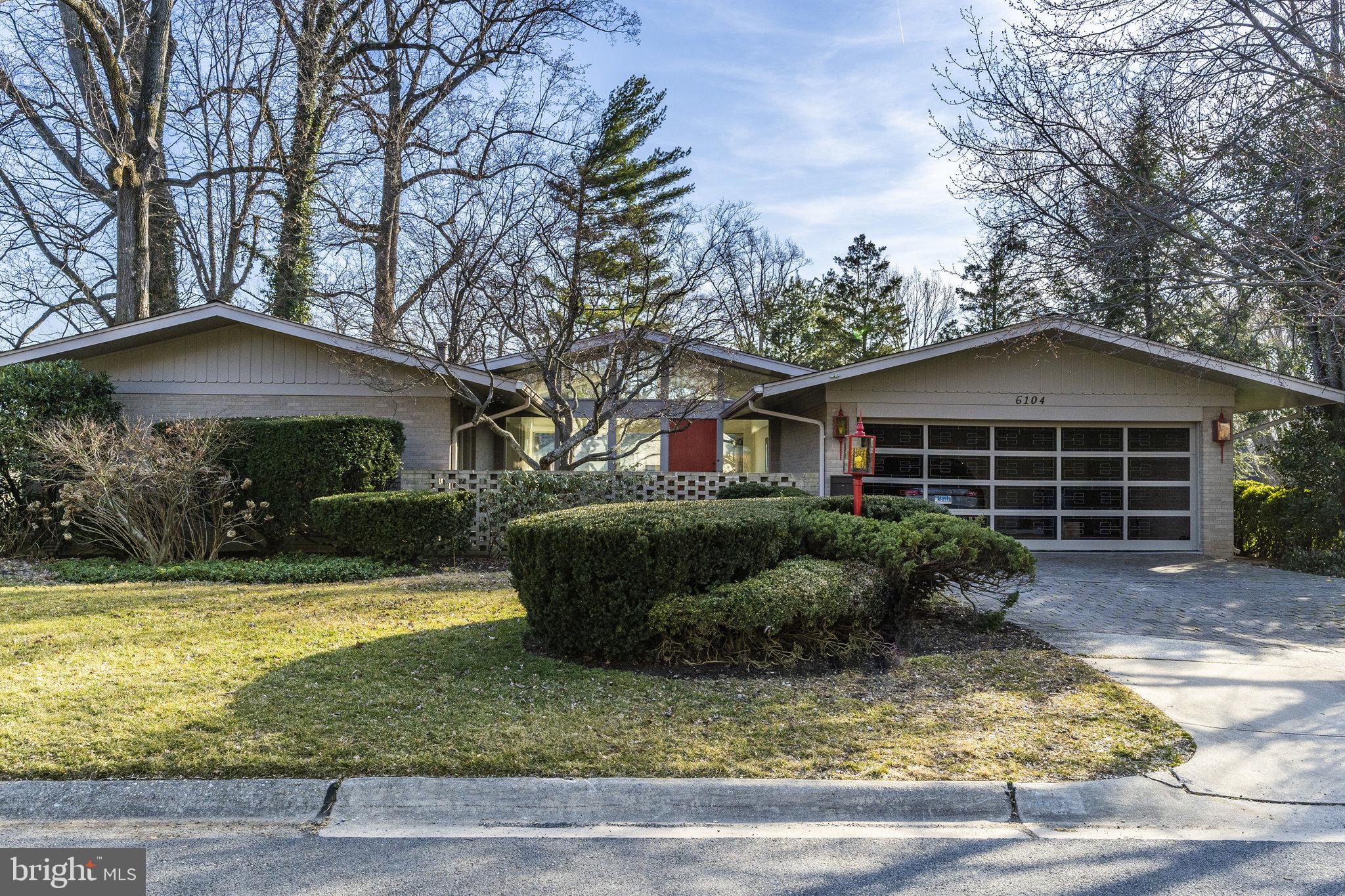 24 month minimum lease term for move-in on August 1st. Come view this magnificent mid-century modern masterpiece. From the moment you step foot on the front patio the original accent wall, large window panes, and gorgeous original garage door hint at something spectacular within. This bright architectural dream was respectfully renovated in 2018, and pulls light in through the numerous picture windows. However, the interior isn't the only show stopper. Take advantage of the upcoming summer and enjoy al fresco dining on the new floating deck while admiring the serene, verdant, a fenced in back yard. The chic renovated kitchen, including newer stainless steel appliances, leads into the family room creating a bright and open floor plan. The main floor also includes 4 bedrooms, 3 bathrooms, a dining room, and a living room. The enormous bright walkout basement is complete with generous storage space, a bedroom, a bathroom, a wet bar, and a massive recreation room. Situated less than 2 miles from Downtown Bethesda and walkable to Walt Whitman HS and Pyle MS. Understated elegance at level is hard to find.