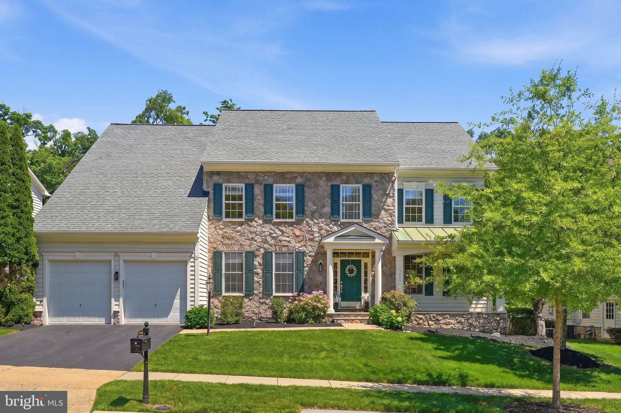 GORGEOUS HOME IN LANSDOWNE ON THE POTOMAC! Beautifully maintained single-family home with over 5300 square feet of modern living space offering 4-finished levels including a loft and a private fenced backyard backing to trees! This gracious home features welcoming curb appeal with a stone and vinyl siding elevation.

Step inside to a dramatic two-story foyer with iron balusters on the oak staircase and hardwood floors throughout the main and upper levels. The main level offers formal living and dining rooms, a private office with built-ins, powder room, and a family room with elegant, coffered ceilings and gas fireplace. The gourmet kitchen opens seamlessly to the family room and features cherry cabinetry, granite countertops, tile backsplash, center island, pantry, and a bright breakfast area overlooking the backyard. Black appliances include a 5-burner gas cooktop and double wall ovens.

Upstairs, the spacious primary suite includes a sitting room, coffered ceilings, and a private bath with dual vanities, soaking tub, and separate shower. Three additional well-sized bedrooms include one with an en-suite bath and two sharing a bath. The upper loft level adds a bedroom, full bath, and flexible space ideal for guests, office, or recreation.

Rest and relax in the fully finished walk up lower level featuring a large recreation room with laminate flooring, bonus room, full bath, storage, and a washer and dryer (2023). Enjoy the fully fenced backyard with patio, ambient lighting, irrigation system, and peaceful views...perfect for barbecues, entertaining or stargazing. Additional highlights include a two-car front-load garage, mud room with washer/dryer hookups, fresh paint, roof (2024), two HVAC systems (upper 2019), sump pump with battery backup, security system, and irrigation system.

Live your best life in Lansdowne! Residents enjoy resort-style amenities in the highly sought-after community including indoor and outdoor pools, fitness center, sport courts, playgrounds, trails, and year-round community events. Ideally located minutes from downtown Leesburg, Reston Town Center, and Dulles International Airport, this home offers the perfect blend of luxury living, community, top-rated schools, and an exceptional location!