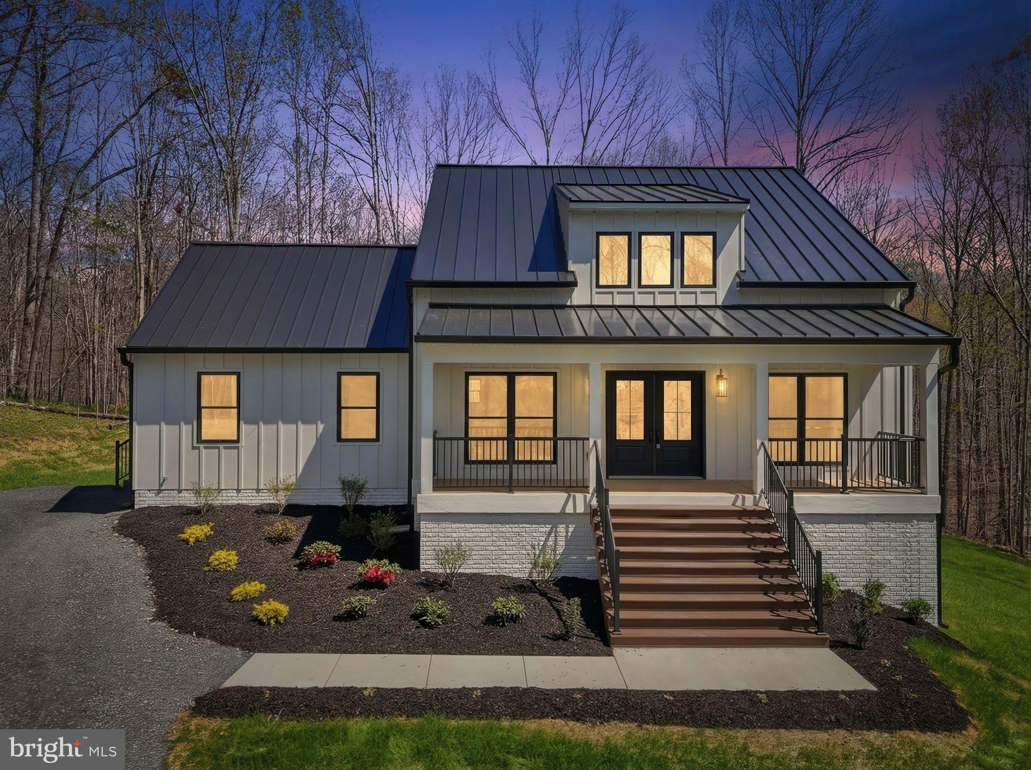 The Modern Farmhouse Reimagined and Thoroughly Refined!  Beautifully situated on 14+ acres, this 4 Bed/3 Bath Home is Nothing short of a masterpiece ... You'll realize something is truly different the moment you drive up.  From the board and batten siding to the standing seam metal roof. The moment you open the front door, you'll be in awe of the soaring ceilings and refined spaces.  Luxury vinyl plank throughout most of the house and beautiful tile in all the bathrooms and mud room.  The gourmet kitchen is incredible with its upgraded countertops and finishes ... don't overlook the high-end Kitchen Aid appliance package or walk-in pantry with sliding barn door.  Primary suite with massive vaulted ceiling and luxurious bath with custom tile walk-in shower.  Large dining room. Synthetic custom screened porch with grilling deck.  Finished lower level with oversized rec room, 2 additional bedrooms, fantastic bath and cozy office/study.  This home is simply not to be missed!!