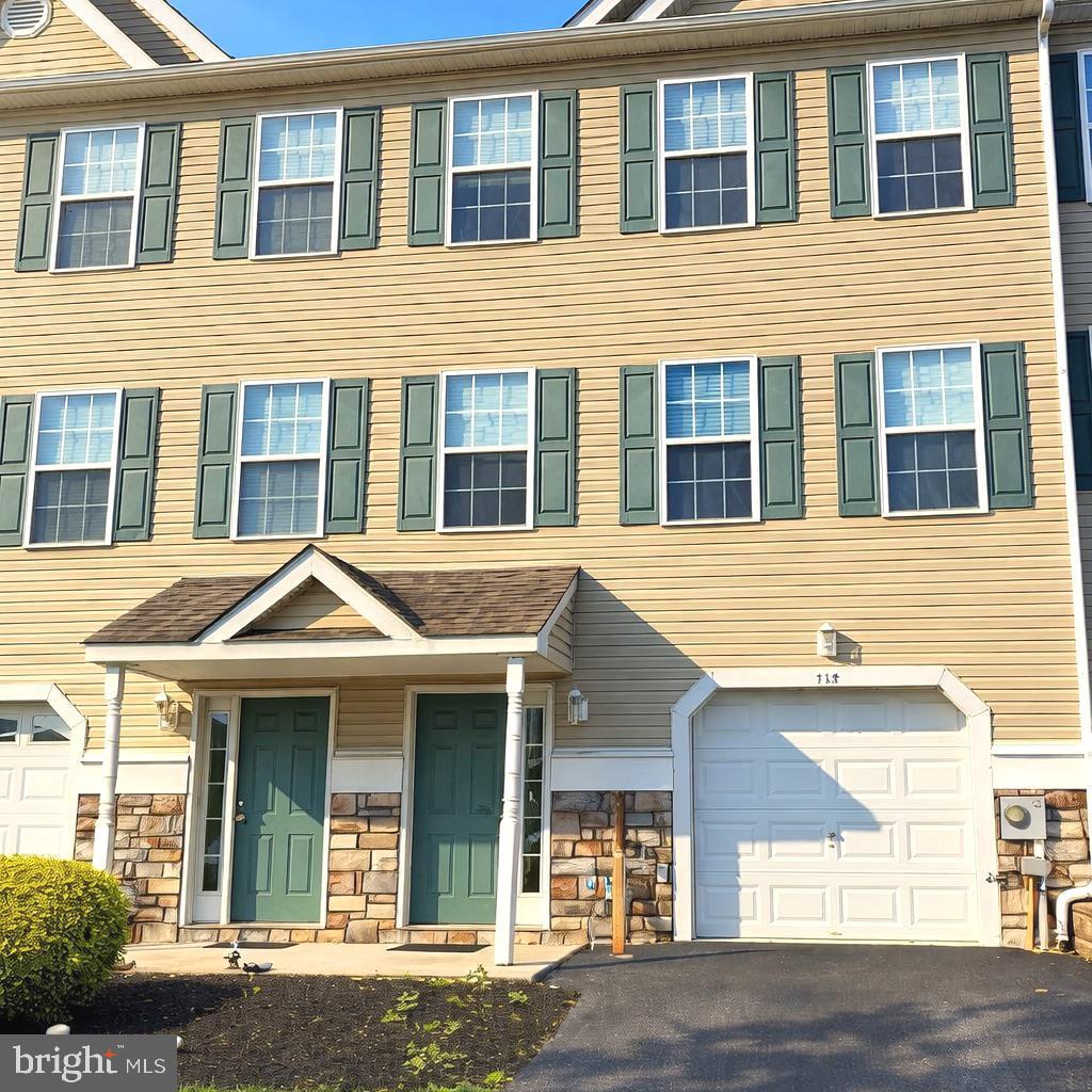 Nestled in the charming Baldwin Run community, this delightful townhouse offers a perfect blend of comfort and style. Built in 2011, this traditional home features a warm and inviting atmosphere, ideal for creating lasting memories. The spacious dining area is perfect for hosting dinner parties, while the well-appointed kitchen boasts a pantry for all your culinary needs. The living room is enhanced by a cozy gas fireplace, providing a focal point for relaxation during chilly evenings. Natural light pours in through large windows, creating a bright and airy ambiance throughout the home. With three generously sized bedrooms, including a primary suite complete with a luxurious en-suite bathroom and walk-in closet, there’s ample space for everyone to unwind. The additional full and half bathrooms ensure convenience for both residents and guests. The fully finished basement offers versatile space that can be tailored to your lifestyle—think home office, playroom, or media center. Enjoy the ease of an attached garage and driveway parking, making daily life a breeze. This low-maintenance property, with its vinyl and aluminum siding, allows you to spend more time enjoying your home and less time on upkeep. Experience the comfort and convenience of Baldwin Run—your new sanctuary awaits!