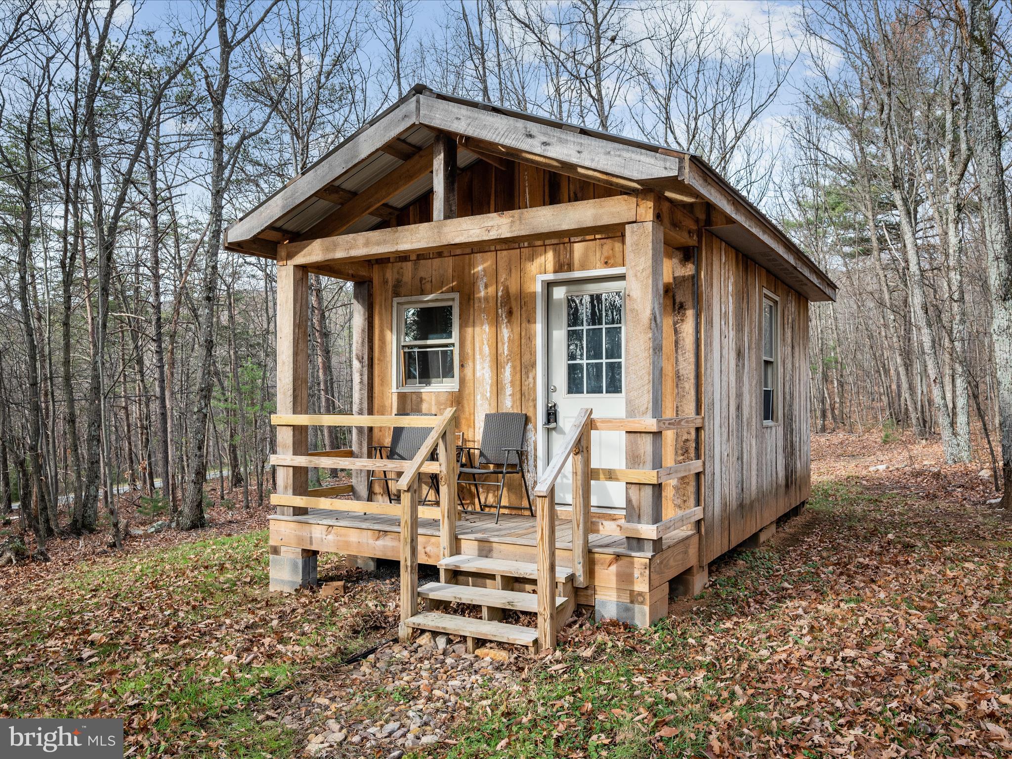 Escape to your own private mountain retreat with this stunning 5-acre parcel nestled in the Virginia mountains, just minutes from the West Virginia State line and the renowned Tuscarora Hiking Trail. Perfect for outdoor enthusiasts and those seeking tranquility, this property offers an ideal off-grid lifestyle.

The property features a cozy off-grid cabin, complete with installed septic and an outhouse for convenience. Gather with friends and family around the large, durable concrete firepit, perfect for evening campfires under a starlit sky. Surrounded by nature's beauty, this serene setting provides endless opportunities for hiking, wildlife watching, and relaxation.

Whether you’re looking for a weekend getaway or a place to reconnect with nature, this property is a rare find. Don’t miss your chance to own this slice of mountain paradise before the Fall Leaves make their appearance!