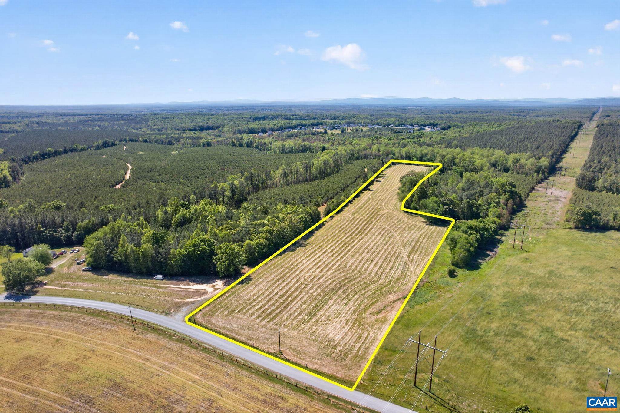 Open 12.23-acre level lot with partial fencing, recently surveyed and approved for a 4-bedroom conventional septic system. Conveniently located between Scottsville and Fork Union, and just 35 minutes from Charlottesville.