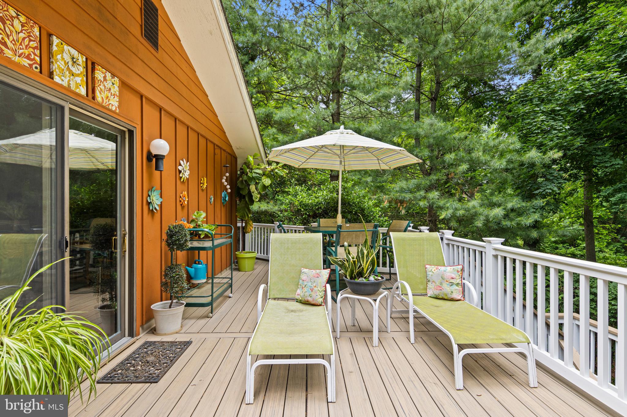 Welcome to a home that surprises at every turn. Set on just under one acre in the privacy of mature trees and greenery, this distinctive bi-level carries the warmth and clean lines of mid-century modern architecture   thoughtfully maintained and rich with personality.

A slate-floored entrance draws you upstairs to the heart of the home, where an eat-in kitchen with a skylight above the sink, warm maple cabinetry, a built-in wine rack, and a peninsula counter with seating sets the tone for easy everyday living. The kitchen opens naturally to the dining area and a sweeping great room anchored by an active wood-burning fireplace. Hardwood floors, crown molding, and oversized windows wrap the space in natural light and lush treetop views, with a glass slider leading out to an expansive deck where you can dine, lounge, and entertain amidst the canopy in complete privacy. Friends of the seller have long called this 'the home in the trees'   and one step outside, you'll understand exactly why.

Three bedrooms are positioned on the upper level, including a corner en suite primary with windows on two walls . The bathroom features a skylight & a sealed steam-shower   a genuine retreat. The second corner bedroom offers the same dual-exposure light. The third bedroom is currently used as a den with hardwood floors and a bold mid-century wall treatment. The hall bath is a standout, featuring a glass vessel sink, green top vanity, classic tile work, and a skylight that fills the space with natural light.

On the first floor, the home opens into a true recreation destination. A handsome wood bar with stools and lighted shelving, a pool table, and a dedicated wine cellar make this the kind of space people remember. The sunroom is wrapped in windows overlooking the grounds, it currently serves as an exercise room and features a working sauna and direct access to the lower patio. The fourth bedroom has two windows which add light & views of the surrounding greenery. It is flexible space that works equally well for guests, a home office, or both. A powder room and laundry complete this level, along with an attached two-car garage tucked neatly into the first floor footprint, a feature that sets this bi-level apart.

The fenced side yard provides open play space to this wooded sanctuary   a rare and lovely combination on 3/4+ acres of private, tree-filled grounds.

All of this in a location that simply works: served by the award-winning Tredyffrin-Easttown School District, walk to the Daylesford train station for an easy commute to Philadelphia, stroll to the Upper Main Line YMCA. Enjoy quick access to the dining, shopping, and conveniences of the Main Line.

This one lives larger than it looks   and feels like nowhere else.