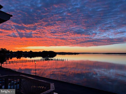 Discover a rare gem in Essex offering unmatched water views rarely found anywhere in the city. This stunning waterfront townhome features three fully finished levels and an affordable HOA, blending lifestyle and value seamlessly. Thoughtfully upgraded throughout, the home showcases wall-to-wall closets with stylish barn doors, creating both function and character. Both full baths are beautifully appointed with rain showerheads, adding a spa-like touch to everyday living. Enjoy the low/no maintenance front and rear yards. Just a quick sweep (not mow), then let the entertaining begin.  Private parking is tucked away on a no-through street, offering peace and convenience. The community completes the experience with direct access to a pier and boat slip, making waterfront living effortless. From sunrise reflections to evening breezes, this home delivers a truly special setting designed for comfort, connection, and exceptional coastal living. Photos for this listing have been virtually staged.
