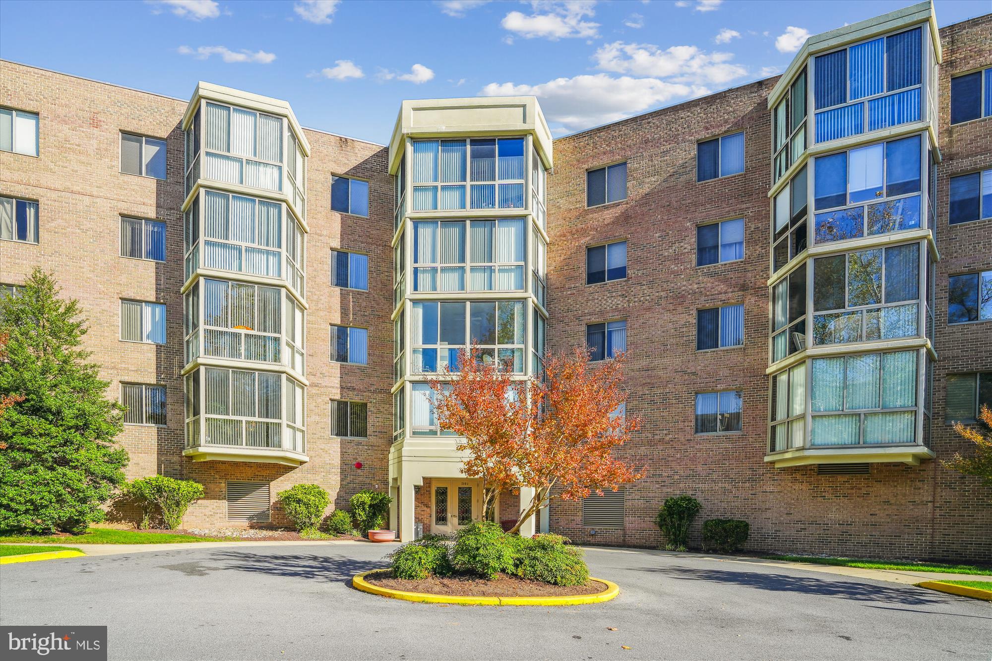 Welcome to  Turnberry  Courts at Leisure World, one of the community's most active and desirable buildings .Two bedroom, two bath condo with a large den/library offers a flexible floor plan, secure building, garage parking space and a private storage cage in a dedicated temperature controlled area.

Freshly painted and move-in ready, the home features beautiful red oak hardwood floors ,generous natural light. Kitchen with stainless steel appliances, quartz countertops, and a large window..  the separate dining and living room is a comfortable space for everyday living and entertaining. Sliding doors open to a four season enclosed living area.

The primary bedroom includes a large walk-in closet with custom built ins and an updated bath.
The second bedroom is located near the second full bathroom. This is located on the opposite side of the condo for guests or a home office setup.   HVAC replaced in 2018.

Leisure World offers exceptional amenities including indoor and outdoor pools, fitness center, award winning tennis courts,  restaurants ,walking trails, shuttle service, clubs, activities, and an on campus Med Star Health.  Turnberry  is a no smoking community known for its active social calendar including lecture series, museum trips and coffees  and happy hours to meet new residents