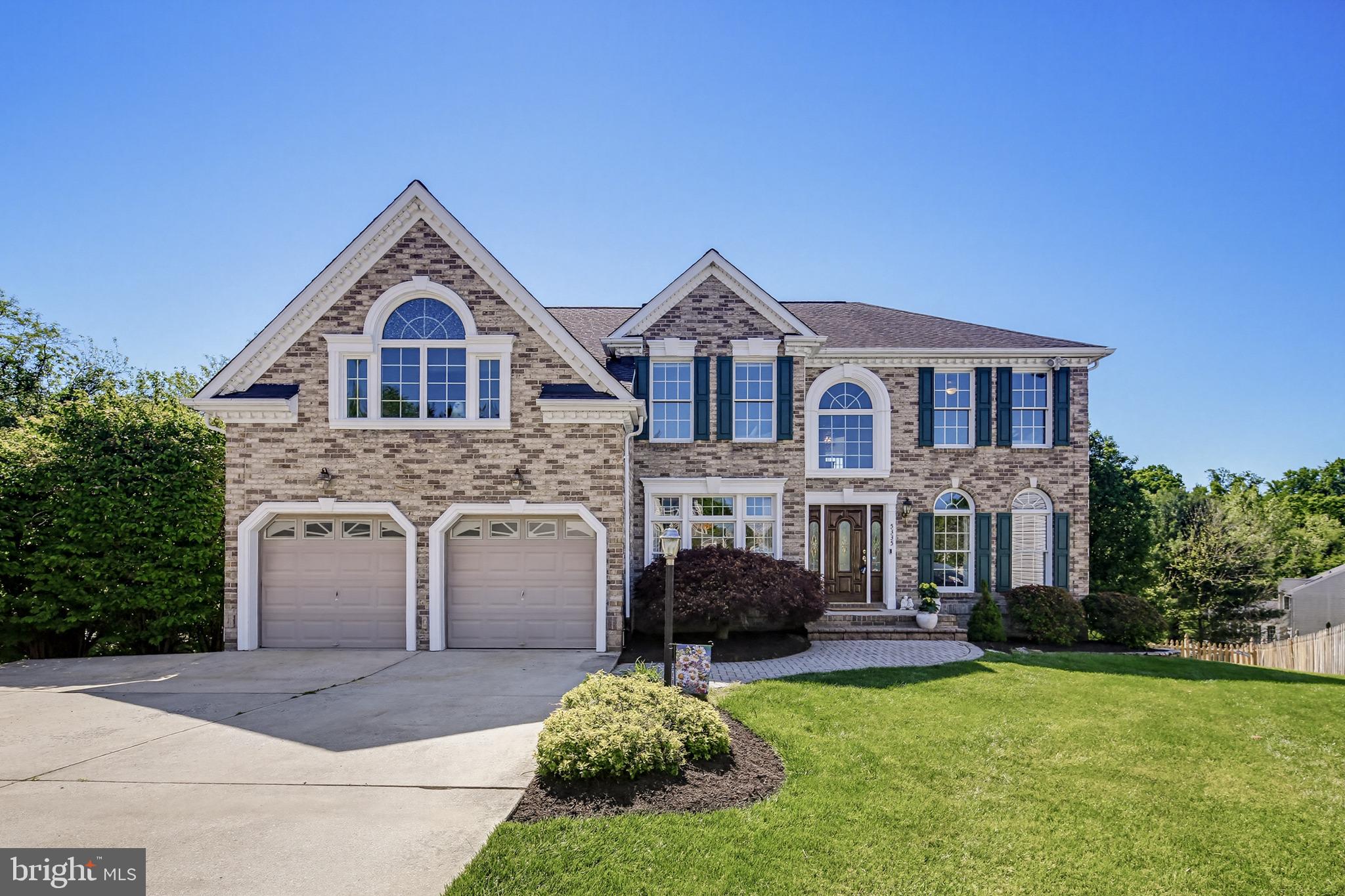 Nestled on a quiet cul-de-sac, this beautifully maintained brick-front colonial offers timeless design, gracious living spaces, and the pride of one-owner ownership throughout. A welcoming center hall foyer sets the tone, flanked by formal living and dining rooms and accented by hardwood flooring throughout most of the main level.

Designed for both everyday comfort and effortless entertaining, the heart of the home is the dramatic two-story family room featuring a floor-to-ceiling stone fireplace and expansive natural light. Just beyond, the spacious kitchen showcases granite countertops, rich cabinetry, stainless steel appliances, a generous center island, and a large casual dining area.

From the kitchen, transition effortlessly to the screened covered porch overlooking the lush, oversized, private fenced backyard, a peaceful setting for morning coffee, relaxed evenings, or entertaining guests. A spacious deck and patio further enhance the outdoor living experience. Backing directly to Rockburn Branch Park, the property offers exceptional privacy and easy access to scenic hiking trails and disc golf just moments away.

The main level also offers a private home office and convenient half bath.

Upstairs, the expansive primary suite serves as a true retreat with a sitting area, dressing space, and a spa-inspired bath complete with dual vanities, soaking tub, and separate shower. Three additional bedrooms provide comfortable accommodations, including one with a private ensuite bath while the remaining two share a well-appointed hall bath.

The finished lower level adds exceptional versatility with a spacious recreation and media area perfect for movie nights, game days, or hosting weekend guests. A full bath and additional room ideal for a den, guest space, or potential fifth bedroom add flexibility, while abundant storage completes the space.

Thoughtfully designed and meticulously cared for, this elegant home offers the perfect balance of sophistication, warmth, and functionality in a beautiful cul-de-sac setting.