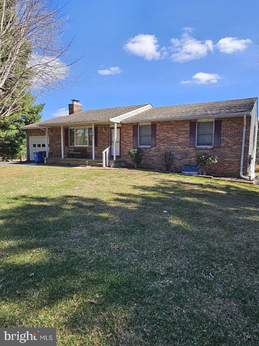 Come home to this well maintained Rancher in much desired Finksburg - Great location for commutes  north or south  - so many options to utilize this space and create your private oasis on a corner lot.  Enter the cozy 20 by 12 living room with a Brick Fireplace with a raised hearth and mantle - enter the U shaped kitchen with Glass backsplash, Deep Stainless sink, tons of storage and Luxury Vinyl Plank flooring, breakfast bar with pass thru to the formal dining room with luxury vinyl plank flooring and a sliding door to a huge freshly painted deck to entertain. There is also a door to the oversized one car garage with custom shelving, garage door opener and a separate attic for more storage.  Down the hallway is a large full bath with a deep linen closet, ceramic tile flooring and a tub shower combo.  Two bedrooms - one with a ceiling fan and finally the Spacious Primary Bedroom with a double closet, ceiling fan and a Primary Bath complete with ceramic tile and a shower stall.  The Lower Level hosts a Huge newly painted and carpeted Family room with a TV and surround sound system that stays! There is also a recreation area with vinyl flooring, room for a wet bar (the rough-in for the sink is already there) workout area and a full sized extra refrigerator to keep cool drinks for hydration.  Also there is a half bath - so convenient when entertaining.  The back rooms in the lower level include a laundry area with laundry tub, long workbench with peg boards to hang tools - the utility area and more custom shelving!  The list goes on and on!  Make your appointment now  - this listing activates by July 6, 2026 - be the first one in so you don't miss out!!
