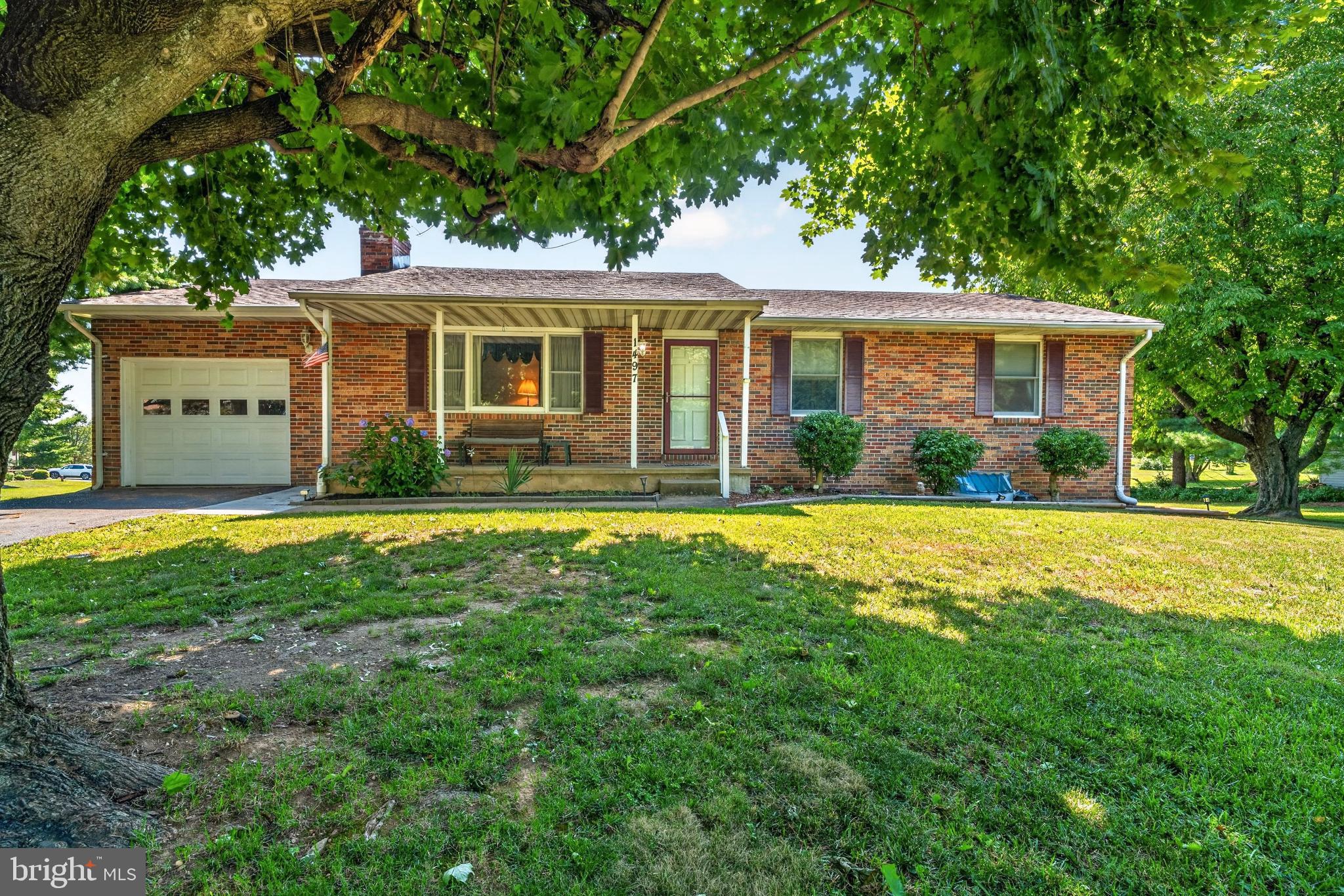 NEW PRICE - PROFESSIONAL PICTURES!!   Come home to this well maintained Rancher in much desired Finksburg - NO HOA- Great location for commutes  north or south  - so many options to utilize this space and create your private oasis on a corner lot.  Enter the cozy 20 by 12 living room with a Brick Fireplace with a raised hearth and mantle - enter the U shaped kitchen with Glass backsplash, Deep Stainless sink, tons of storage and Luxury Vinyl Plank flooring, breakfast bar with pass thru to the formal dining room with luxury vinyl plank flooring and a sliding door to a huge freshly painted deck to entertain. There is also a door to the oversized one car garage with custom shelving, garage door opener and a separate attic for more storage.  Down the hallway is a large full bath with a deep linen closet, ceramic tile flooring and a tub shower combo.  Two bedrooms - one with a ceiling fan and finally the Spacious Primary Bedroom with a double closet, ceiling fan and a Primary Bath complete with ceramic tile and a shower stall.  The Lower Level hosts a Huge newly painted and carpeted Family room with a TV and surround sound system that stays! There is also a recreation area with vinyl flooring, room for a wet bar (the rough-in for the sink is already there) workout area and a full sized extra refrigerator to keep cool drinks for hydration.  Also there is a half bath - so convenient when entertaining.  The back rooms in the lower level include a laundry area with laundry tub, long workbench with peg boards to hang tools - the utility area and more custom shelving!  The list goes on and on!  Make your appointment now  - be the first one in so you don't miss out!! PROFESSIONAL PICTURES COMING SOON