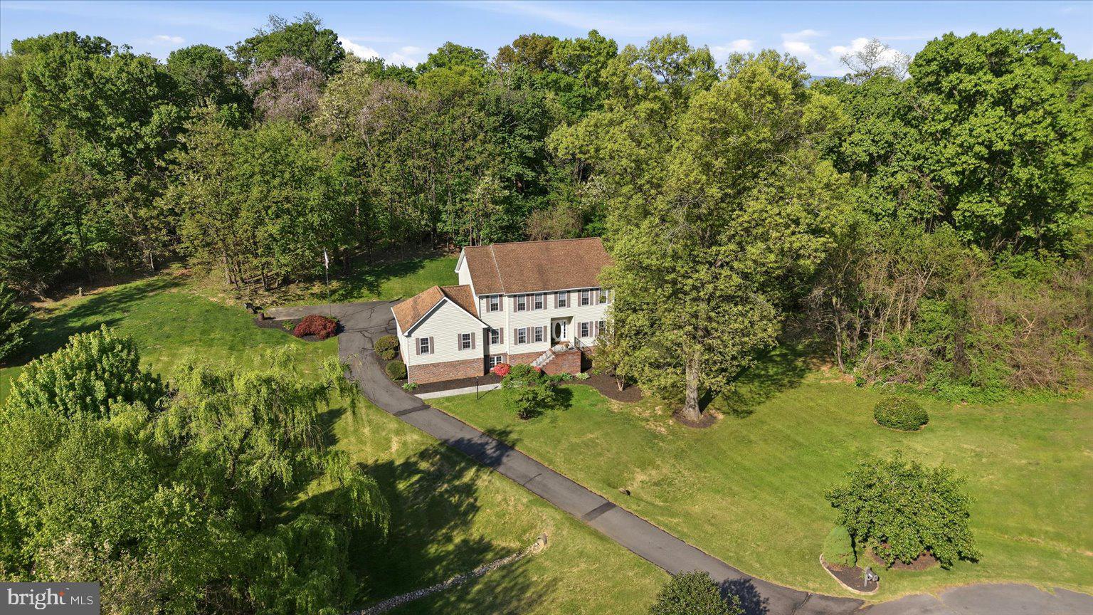 Why settle for a small lot when you can enjoy more than 2 private acres in Berry Hill? This 4-bedroom Colonial offers the rare combination of neighborhood living and the privacy of a wooded retreat, all just minutes from Winchester and major commuter routes.

Tucked away on more than 2 private, partially wooded acres in the desirable Berry Hill community, this 4-bedroom Colonial offers the space, privacy, and flexibility that today's buyers are seeking. Built in 2002 and featuring approximately 2,700 finished square feet, this home combines peaceful country living with convenient access to Winchester, commuter routes, shopping, and dining.

The traditional floor plan provides generous living and entertaining spaces filled with natural light and views of the surrounding landscape. The spacious kitchen opens to comfortable gathering areas, creating the perfect setting for everyday living, holiday celebrations, and hosting family and friends.

Upstairs, you'll find four well-proportioned bedrooms, including a relaxing primary suite designed as a private retreat. The unfinished walkout basement offers tremendous opportunity to expand your living space with a future recreation room, home office, fitness area, guest suite, or workshop while still maintaining ample storage.

Outside, the property truly shines. Mature trees provide a sense of seclusion and privacy while the open areas offer room for gardening, play, pets, and outdoor entertaining. Whether enjoying your morning coffee surrounded by nature or gathering around a firepit on a cool Virginia evening, this property offers the lifestyle many buyers dream about but rarely find.

Complete with a two-car garage and located on one of Berry Hill's spacious homesites, this property presents a unique opportunity to enjoy acreage, privacy, and a well-maintained Colonial home in Frederick County.