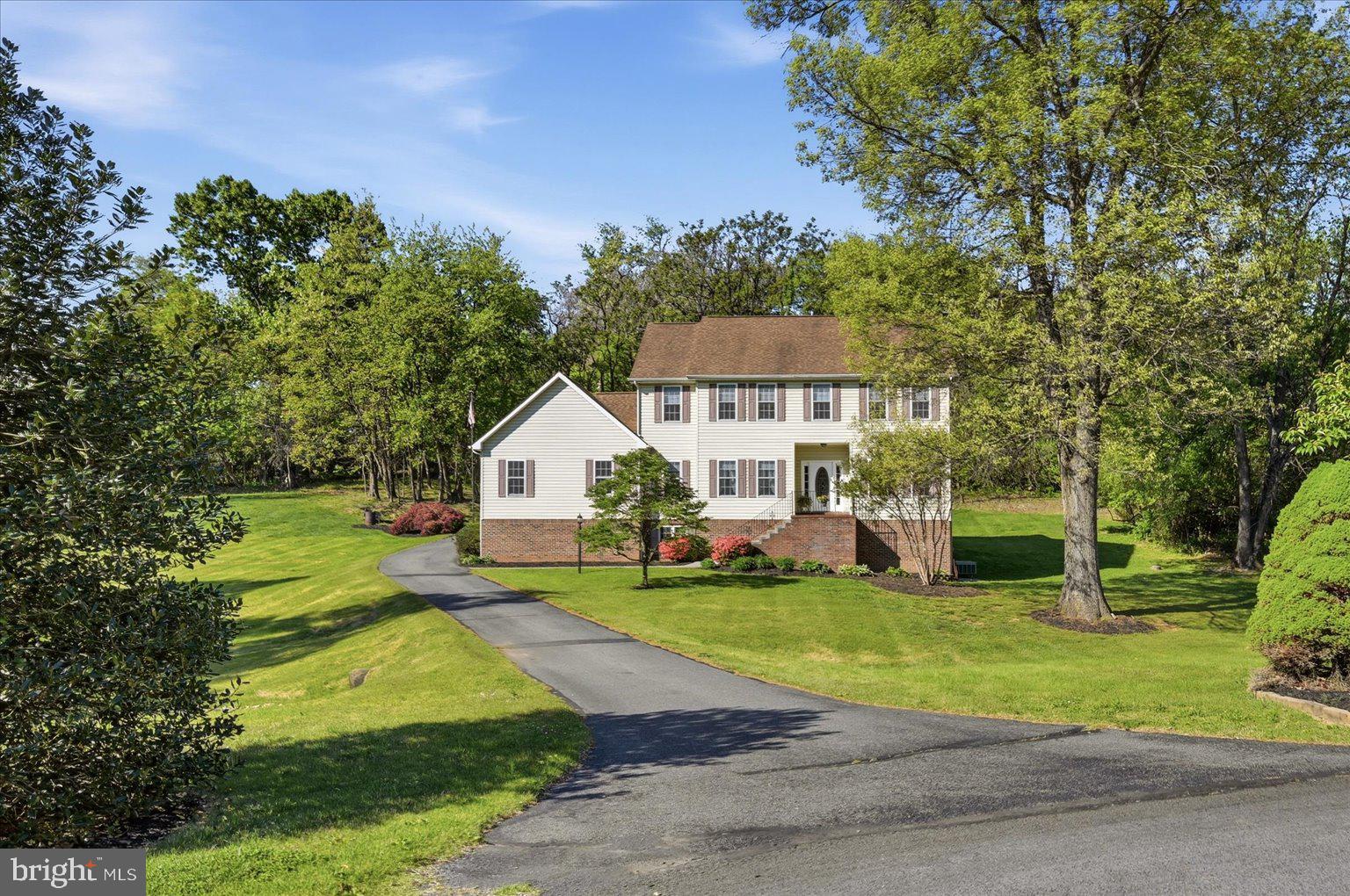 *** IMPROVED PRICE***Why settle for a small lot when you can enjoy more than 2 private acres in Berry Hill? This 4-bedroom Colonial offers the rare combination of neighborhood living and the privacy of a wooded retreat, all just minutes from Winchester and major commuter routes.

Tucked away on more than 2 private, partially wooded acres in the desirable Berry Hill community, this 4-bedroom Colonial offers the space, privacy, and flexibility that today's buyers are seeking. Built in 2002 and featuring approximately 2,700 finished square feet, this home combines peaceful country living with convenient access to Winchester, commuter routes, shopping, and dining.

The traditional floor plan provides generous living and entertaining spaces filled with natural light and views of the surrounding landscape. The spacious kitchen opens to comfortable gathering areas, creating the perfect setting for everyday living, holiday celebrations, and hosting family and friends.

Upstairs, you'll find four well-proportioned bedrooms, including a relaxing primary suite designed as a private retreat. The unfinished walkout basement offers tremendous opportunity to expand your living space with a future recreation room, home office, fitness area, guest suite, or workshop while still maintaining ample storage.

Outside, the property truly shines. Mature trees provide a sense of seclusion and privacy while the open areas offer room for gardening, play, pets, and outdoor entertaining. Whether enjoying your morning coffee surrounded by nature or gathering around a firepit on a cool Virginia evening, this property offers the lifestyle many buyers dream about but rarely find.

Complete with a two-car garage and located on one of Berry Hill's spacious homesites, this property presents a unique opportunity to enjoy acreage, privacy, and a well-maintained Colonial home in Frederick County.