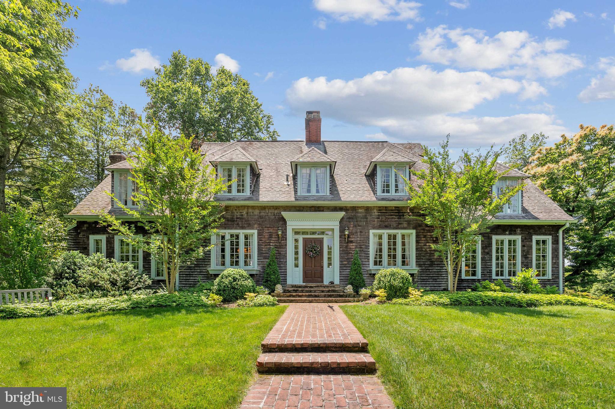 Charming Nantucket-style Shingle Residence on 1+ acres located in close-in McLean. Gracious sized rooms include a formal living room with limestone fireplace surround, a period fireplace mantle in the library, and a breakfast room with French doors overlooking a brick terrace and tastefully landscaped back garden. Originally built in 1927 and upgraded over the years, this residence also includes a detached two-car garage with an office above; a circular pea gravel driveway adds to the charm of this residence.