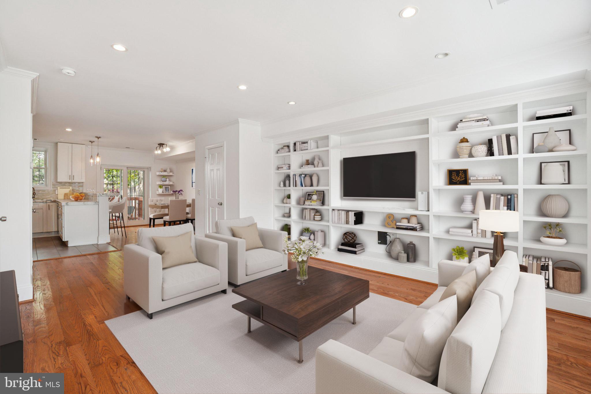 Open House this Sunday 6/14 from 1-3pm!
Beautifully maintained Capitol Hill charmer located on a friendly block! Original renovation by locally renowned Dilan Homes. Lives SO MUCH BIGGER than the Sq Ft listed. As you arrive, you're greeted by an adorable front porch and small flower garden. Step inside to find a spacious living area anchored by newly installed custom bookshelves — the perfect blend of style and functionality — and a wide open floor plan. Enjoy pristine hardwood flooring and an updated kitchen with all stainless steel appliances. Natural lighting from the sliding glass door, kitchen, and living room windows gives this main level that cozy touch. Head upstairs and find TWO full baths and high ceilings throughout the upper level! The large main bedroom offers plenty of room for a king-size bed and sitting area, plus a fully remodeled closet with added space and gorgeous barn doors. REAL second and third bedrooms offer plenty of flexibility. Walk out back and find a beautiful fenced-in patio and deck — the perfect space for hosting, gardening, and relaxing. You are surrounded by parks, shops, and restaurants. Just a 10-minute walk to METRO, and close to Lincoln Park, H Street, Eastern Market, Union Market — the list goes on. Welcome home!