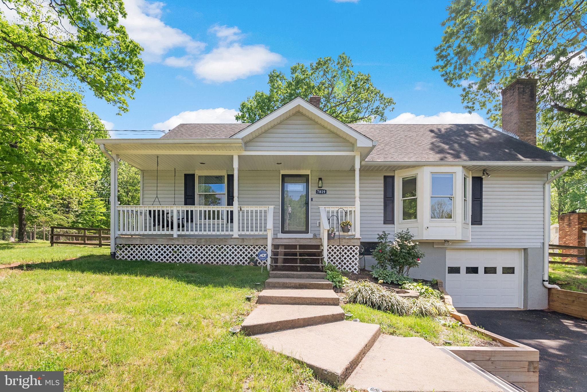 Welcome home! This charming three-level home is located on half an acre of land with lovely modern updates, rare main level bedrooms, and an abundance of storage! Step onto the idyllic front porch to sip your morning coffee or relax on the porch swing on a beautiful day. Inside the entrance, the living room is welcoming, featuring a cozy brick fireplace and a wide bay window flooding the space with natural light. Continue into the home and discover a spacious and bright eat-in kitchen, boasting refinished cabinets, brand new quartz countertops (2025) and newer stainless steel appliances, including a brand new refrigerator (2025). Pull up a stool to the peninsula bar, or enjoy a meal in the light-filled breakfast nook with a peaceful view of your lush backyard. Off of the kitchen, you’ll find a large laundry room, with newer washing machine and dryer (2023) and additional pantry storage. Down the hall two rare main level bedrooms are both sizable with ceiling fans, large closets and shared access to the handsome full bathroom in the hallway. Upstairs, the primary bedroom suite is spacious, boasting a wide closet and handsome en suite bathroom. The second bedroom on this level is generously-sized with soft carpeting and two large closets. From this level, you’ll also have access to the spacious crawl space for convenient storage. Downstairs, the lower level has been partially finished with luxury vinyl plank flooring to create a second cozy living space. With the third full bathroom on this level, it could easily be converted into a fifth private bedroom space to suit your needs. This level also includes an abundance of storage space and access to the one-car garage. Outside, enjoy outdoor dining and entertaining on the wide Trex deck that leads down to your massive fenced backyard, wish lush grass and mature trees! Two oversized sheds provide you with even more storage space! On the front of the home, you’ll have plenty of parking options with a wide driveway and attached garage. No HOA in this established community! Just minutes to Lidl, Aldi, Walmart, Bull Run Park, Manassas Battlefield Park, Manassas Park Community Center, Prince William County Fairgrounds, and Old Town Manassas. Conveniently located with quick access to I-66, Route 28, Route 29, Route 234, and the Prince William Parkway. Schedule a private tour of your new home today! **ASSUMABLE VA LOAN**