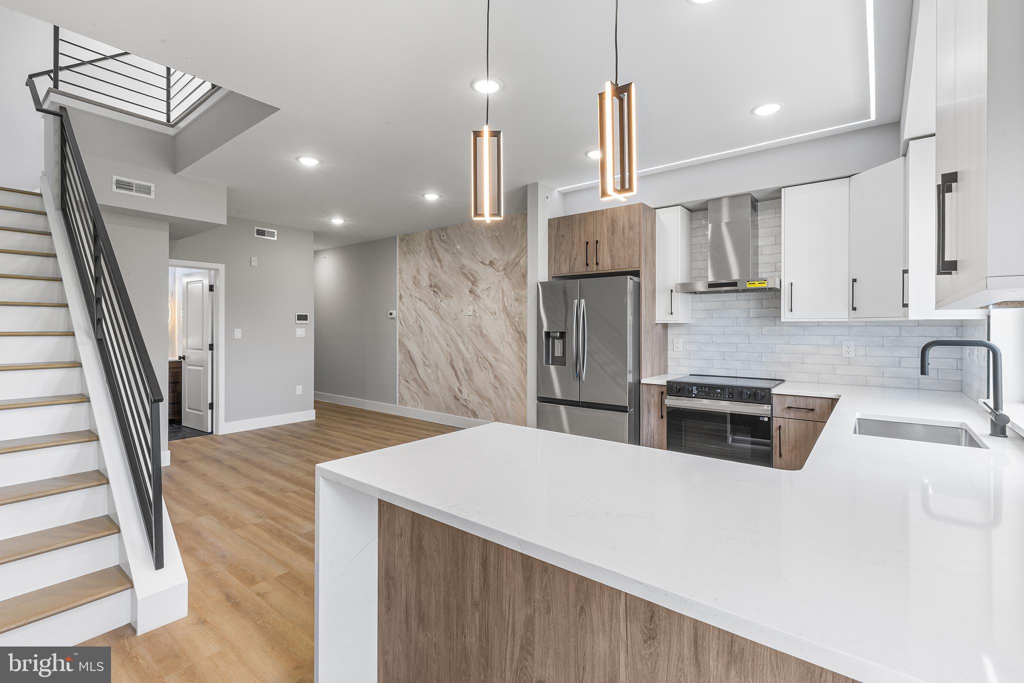 One of a kind new construction triplex located blocks from Girard Ave and Northern Liberties in the heart of booming Olde Kensington. 1413 N 8th offers an incredible opportunity for investors or owner-occupants seeking strong rental potential and luxury finishes. Each unit contains a unique finish palette and features a variety of designer lighting and plumbing fixtures, quartz countertops, stainless steel appliances, and modern open layouts with an abundance of natural light. Access to the private roof deck from the top unit provides unobstructed views of the Center City skyline. This offering is further enhanced by a 1-year builder warranty and a full 10-year tax abatement. Surrounded by thriving new development, vibrant retail and dining corridors in Northern Liberties and Fishtown, and just steps from one of the city’s newest pickleball and padel clubs, 1413 N 8th represents a standout investment in one of Philadelphia’s most dynamic and evolving neighborhoods.
