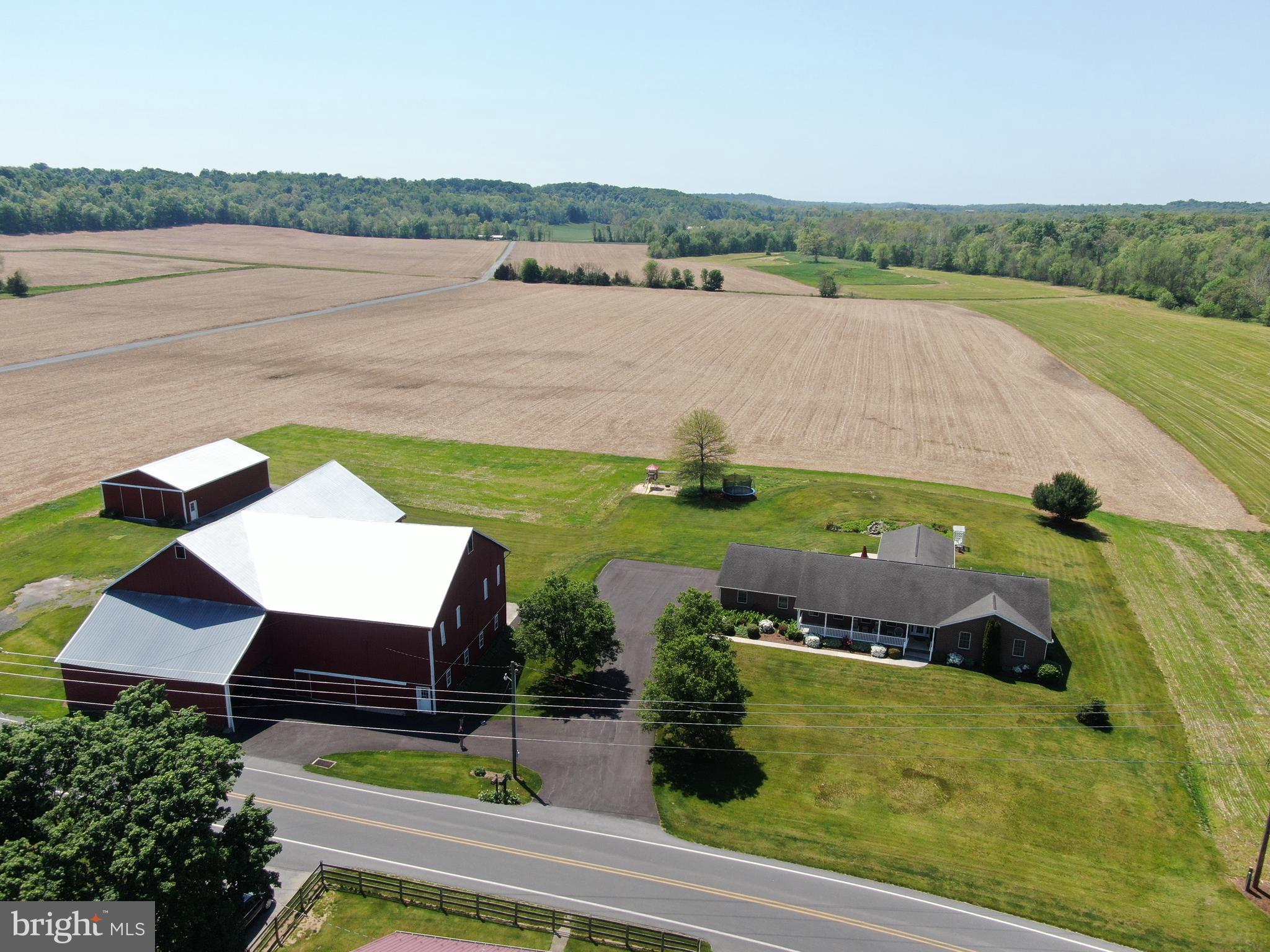 AMAZING BRICK RANCHER WITH STUNNING VIEWS ON 3± ACRES! This exceptional property offers the perfect blend of space, comfort, and country charm, featuring a spacious brick ranch-style home, large bank barn, pole building, and breathtaking views of the surrounding farmland. The home includes 6 bedrooms and 3.5 bathrooms, with 3 bedrooms on the main level and additional bedrooms and living space in the finished basement. The primary suite features a en suite bath and walk-in closet, while a separate in-law suite offers its own outside entrance, open-concept kitchen and living area, spacious bedroom, and full bathroom—ideal for guests, extended family, or multi-generational living. Designed for both everyday living and entertaining, the main level features a kitchen, dining room, family room, living room, and a beautiful great room with vaulted ceilings that is perfect for gatherings, parties, and special occasions. Doors from the great room lead to a relaxing concrete patio overlooking picturesque countryside views. The finished basement provides even more entertaining space with a large recreation/great room, canning kitchen, and several storage rooms. Outside, the level lot offers plenty of usable space along with an attached 3-car garage and inviting front porch. The bank barn is 44x73 with attached straw shed wing and 18x44 overhang and includes a partially finished lower level perfect for gatherings, parties, picnics, and events, while the upper level offers ample storage for equipment, hay, straw, and more. The 36x48 implement shed features electric and sliding doors. Surrounded by beautiful farmland and located in a highly desirable area convenient to Chambersburg, St. Thomas, Rt. 30, I-81, and more, this truly is a dream property offering endless possibilities. Come make this incredible home your own!

This property will be offered at auction on Thursday, July 23, 2026, at 3:00 PM. The list price in no way represents a minimum, starting, or acceptable bid.

This property will be offered in a multi-parcel auction, giving buyers the flexibility to purchase Tract 1, Tract 2, or both tracts. Tract 1: Rancher and Outbuildings on 3+/- Acres, Tract 2: 106.19+/- acres with approx. 96 acres tillable.

Taxes for the entire property are $9,087; taxes may be reassessed dependent on how the property is sold.