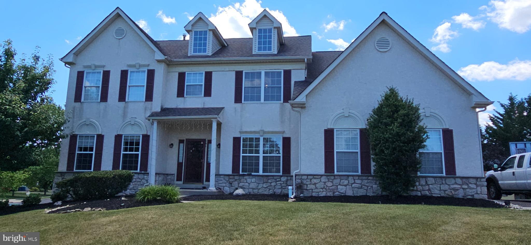 RARE FIND IN MONTGOMERY CROSSING! Welcome to this magnificent, East-facing, Vastu-compliant 4-bedroom colonial built by the David Cutler Group in the award-winning North Penn School District (Gwyn-Nor Elementary). This exceptional home seamlessly blends classic elegance with a massive list of high-end, modern structural and technological upgrades. Step inside a grand two-story center foyer flanked by formal living and dining rooms featuring elegant crown molding. The gourmet kitchen is a chef’s dream, boasting an upgraded center island and perimeter surrounds wrapped in premium granite stone, a steel dual-basin sink, 42" cabinetry, and a bright breakfast area. The kitchen flows effortlessly into a spacious family room anchored by a cozy gas fireplace. For tech enthusiasts, this home is fully modernized with Cat6 Ethernet cabling and Google Nest cameras/smart Wi-Fi coverage across all three finished floors. The spectacular living space extends into a fully finished basement, designed as the ultimate entertainment zone. This massive lower level features an open home theater area, a convenient kitchenette/bar area, a fully renovated full bathroom, and dedicated storage space. For total peace of mind, the basement is protected by a dual sump pump system equipped with a brand-new battery backup. Mechanically, the home is completely turn-key and worry-free, featuring a brand-new air conditioner and heating system (HVAC - both under warranty), alongside a brand-new water heater. Upstairs, the sprawling primary suite serves as a private retreat with vaulted ceilings, walk-in closets, and an en-suite bath, complemented by a full hall bath. Outdoor living is a true highlight: sliding glass doors lead to a massive, premium 20'x40' custom stone patio beautifully framed by professional landscaping and gas line connection for BBQ—perfect for hosting large summer gatherings. The exterior is completed by an extended driveway offering ample parking and a matching 10'x12' external storage shed. Located at a prime location of Montgomery County,  NO HOA fees and minutes from Costco, Bj's, Wegmans, Whole Foods, along with lot more other shopping options near Montgomery Mall,  local train stations and a convenient access to most of the highway routes, this smart, upgraded home is an absolute must-see!