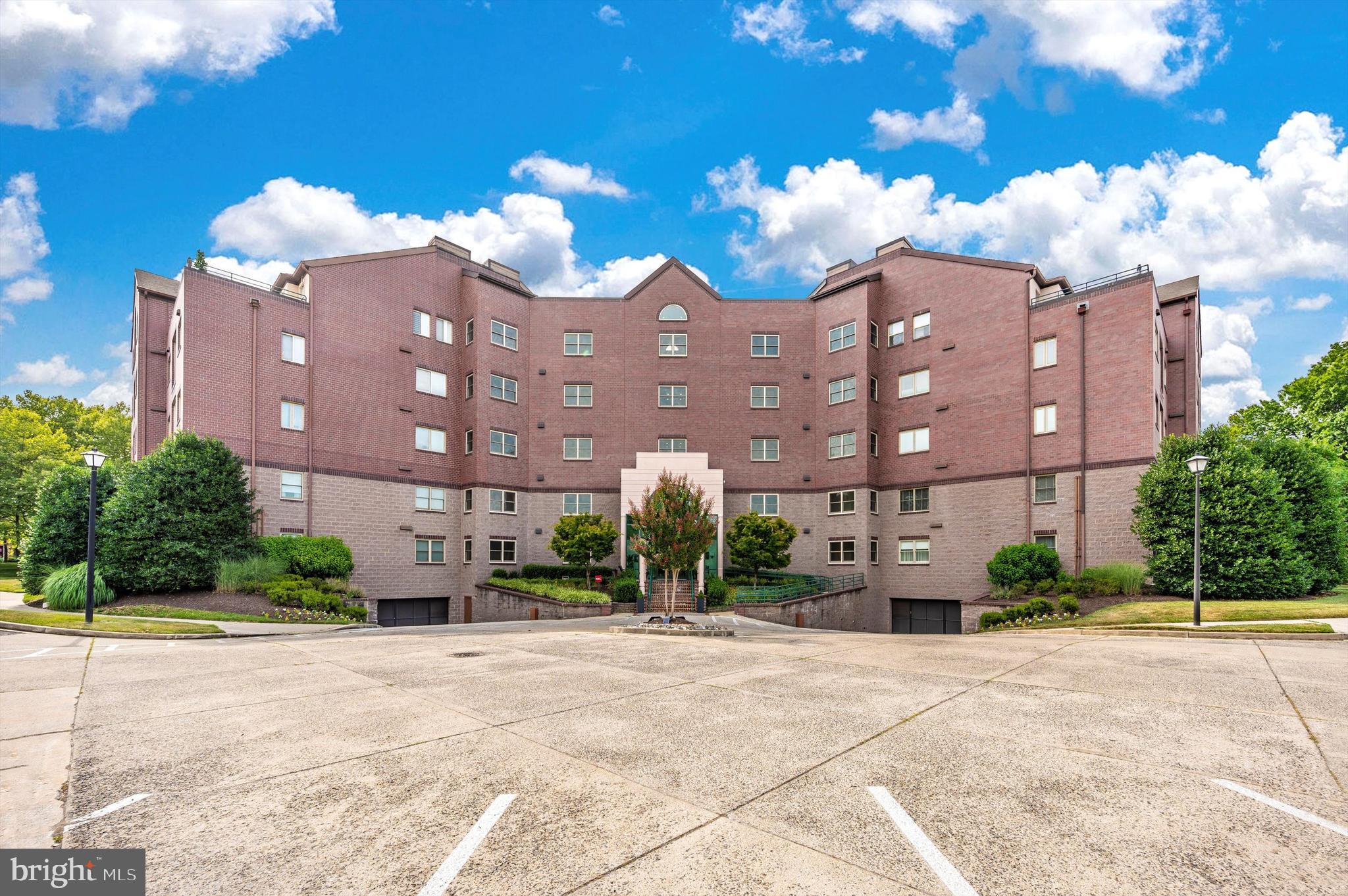 Charming Luxury Condo on the edge of Baker Park.   Discover the perfect blend of comfort, convenience, and style in this beautifully updated, in-town condominium.   With 1,562 square feet of thoughtfully designed living space, this 2-bedroom, 2-full bath home offers everything you need for relaxed living or elegant entertaining.   Step inside to find brand new appliances, new LVP flooring, and freshly painted throughout!   There is a spacious living room with a cozy fireplace, as well as a large, separate dining room, which has many possible uses - home office, library, etc.   Large Master Bedroom with walk-in closet.   Enjoy your private covered patio, perfect for dining.   Located on a quiet cul-de-sac in a secure building with an assigned space/secure garage parking, this condo offers the comfort of a well-managed community with the conveniences of city living.   Condo fee also includes water & sewer, an incredibly-maintained building & grounds, trash (chute in each hallway), snow removal, and generous parking for family & guests.   Elevator to the garage is directly across from this condo, and the assigned space is directly opposite the elevator exit.  Tucked at the edge of beautiful Baker Park, you’re just steps away from walking paths along Carroll Creek, Sunday concerts in the park, and all the vibrant shops, dining, and entertainment downtown has to offer.  Bike or stroll to the heart of the arts & entertainment district or take advantage of easy commuter to the city and airports.   ANOTHER SUBSTANTIAL PRICE REDUCTION!