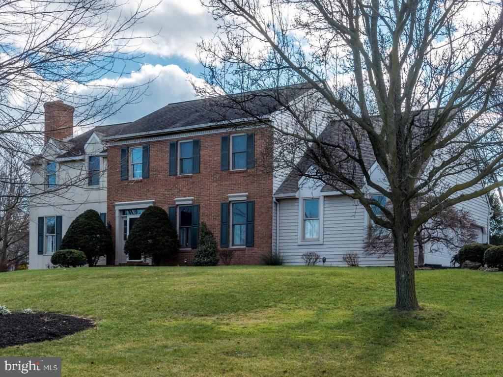Immaculate & spacious home on a large .72 acre corner lot in a popular L/S neighborhood. Main floor features 9ft ceilings & Brazilian cherry HW floors throughout. 4 BRs, 3 full baths, plus 1st flr office/5th BR, 1st flr sunken family rm w/vaulted ceiling, gas fireplace & French doors to multi-tiered deck. Custom cherry kitchen w/granite island/counters & stainless appliances. Living room offers wood burning fireplace. Huge MBR suite