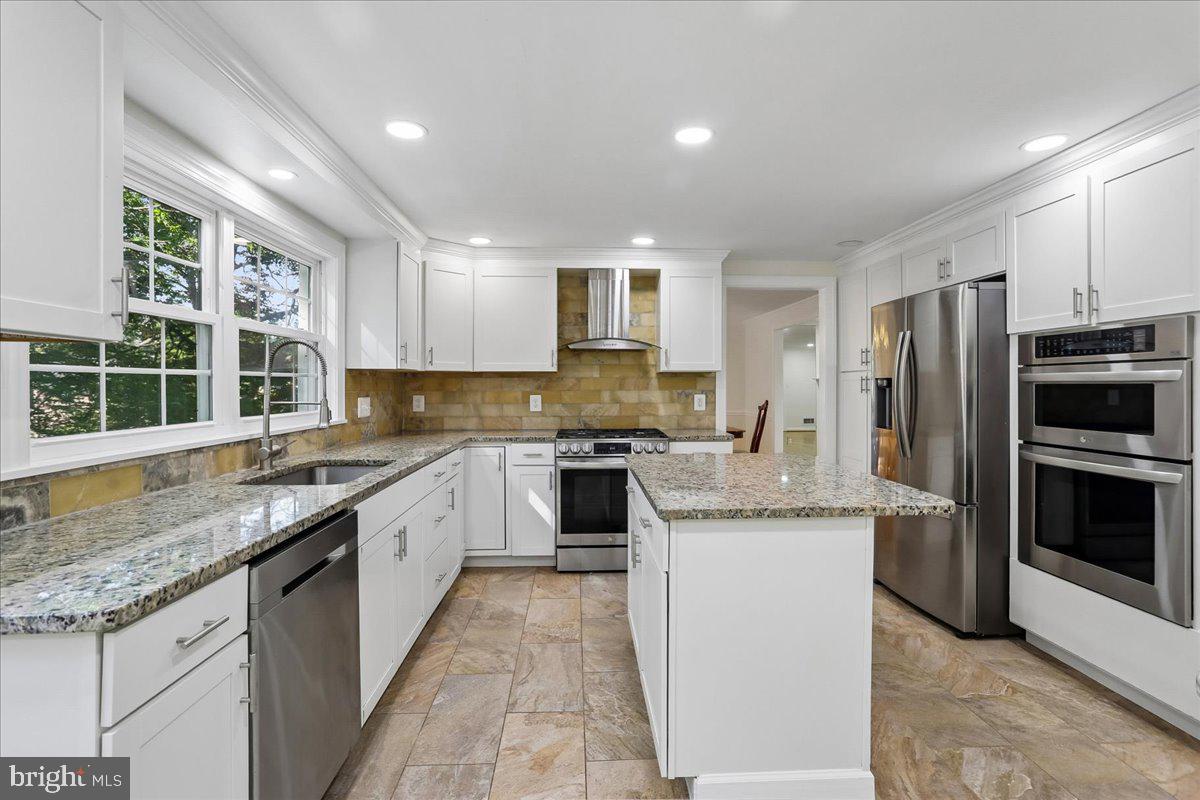 Enjoy peaceful lake views and spacious living in this beautifully updated Montgomery Village home. Offering over 3,700 square feet, this inviting residence features 5 bedrooms, 4 full baths, and 2 half baths, providing plenty of room for everyday living, entertaining, and hosting guests. The kitchen, fully renovated in 2022, is the heart of the home, featuring ample workspace and a sunny breakfast nook perfectly positioned to take in the views. Just beyond, the expansive deck overlooks the lake, creating an ideal setting for morning coffee, outdoor dining, or simply enjoying the surrounding scenery.  Inside, comfortable living spaces are filled with natural light and designed for both gathering and quiet retreat. A dedicated office with floor-to-ceiling built-in bookshelves offers a warm and functional workspace for remote work, study, or a personal library. The spacious primary suite is a true retreat, featuring a private sitting room that leads into the bedroom, two bathrooms, and ample space to relax. Renovated bathrooms, generously sized bedrooms, and a finished basement with an extra room and a separate storage room provide flexibility and room to grow. Whether you’re entertaining friends, working from home, or unwinding after a long day, this home offers a wonderful balance of comfort, character, and functionality.  Major updates completed in 2022 include a new roof, a renovated kitchen, and a replacement AC unit, adding lasting value, efficiency, and peace of mind. Complete with a two-car garage and conveniently located near parks, walking trails, shopping, dining, and commuter routes, this special lake-view property combines thoughtful updates, generous space, and a setting that feels both peaceful and connected. Professional pic on  06/06/26