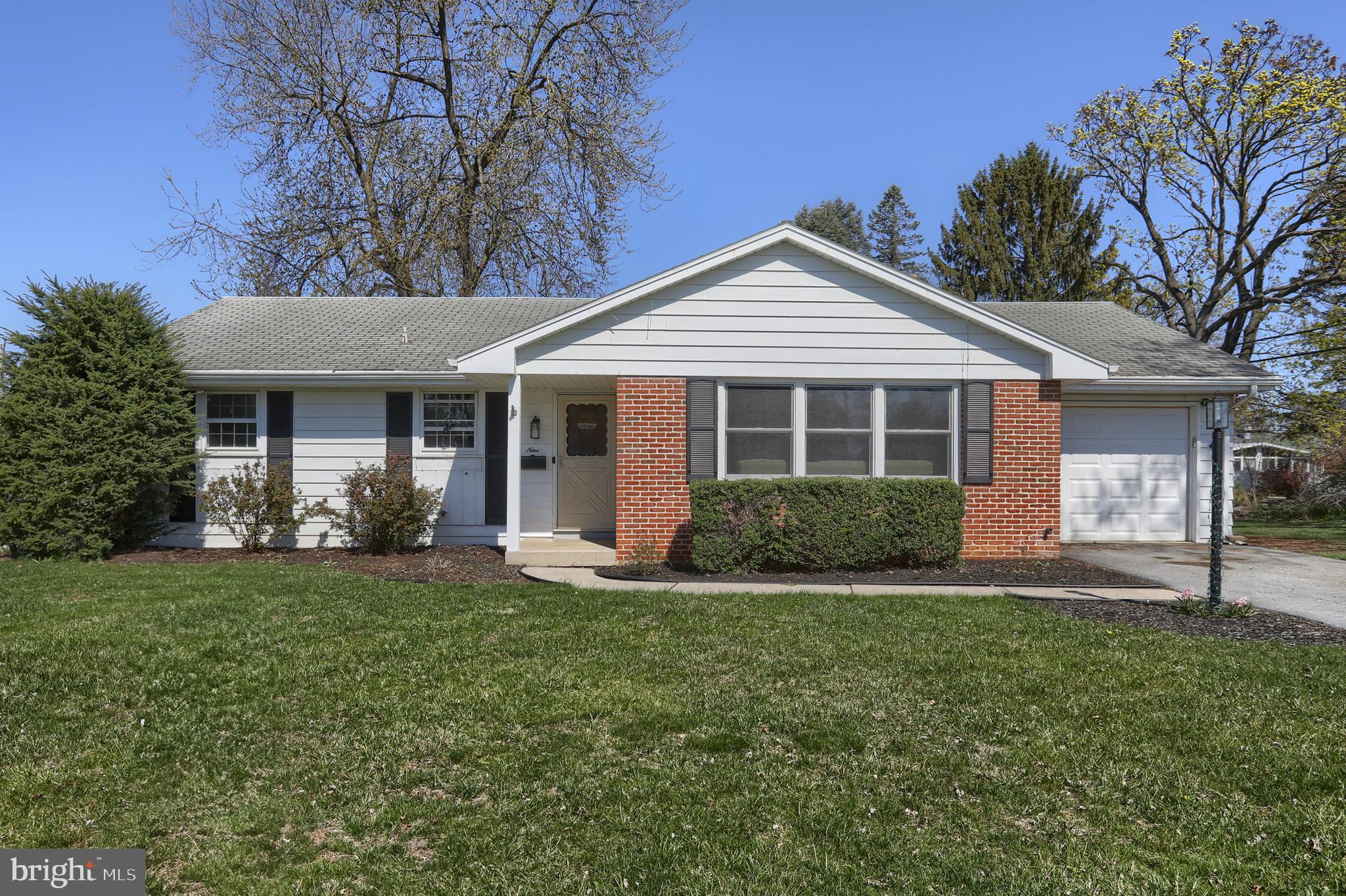 Enjoy one floor living in this sweet ranch home in a great neighborhood.  This super convenient location is  just a short walk to schools, pool and playground.  New gas furnace installed in 2023 plus new windows in living room and two bedrooms.   Lovely hardwood flooring in living room, hall and all bedrooms.  Kitchen features ceramic tile flooring, pantry and a new fridge and is open to a spacious dining area.  From there, sliding doors lead out to a delightful screened porch - perfect place to enjoy your morning coffee, meals or evening beverages in mild weather.   Laundry hookups conveniently tucked into a nook in the garage.  The basement offers potential for additional living space, if desired.  A beautiful, large back yard completes the picture including a shed which also doubles as a greenhouse.  Add this sweet home to your must see list!
