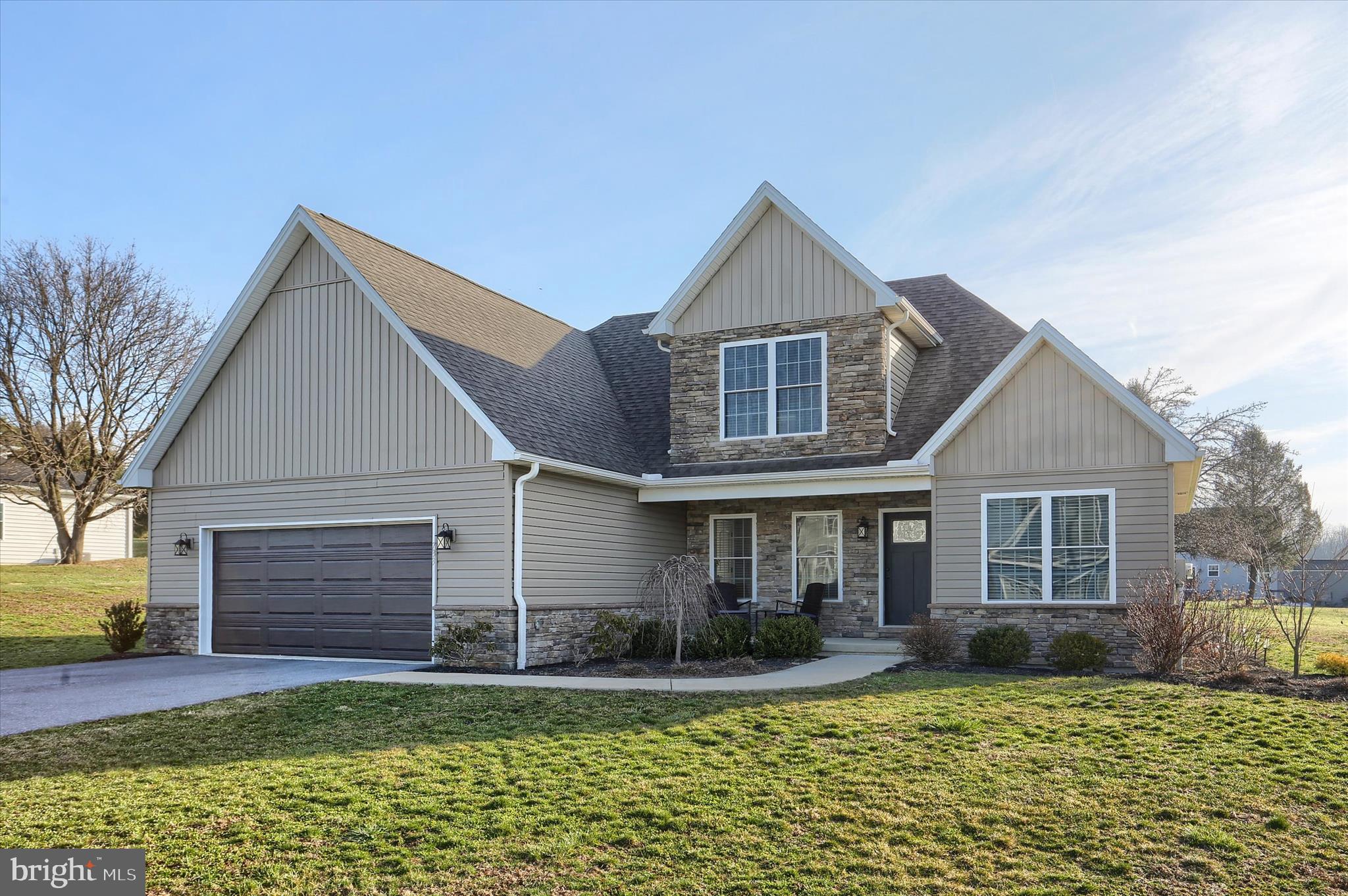 Better-than-new and just 3 years young, this custom-built home showcases quality materials and exceptional craftsmanship throughout. Featuring durable luxury vinyl plank flooring and a desirable open floor plan, the layout is perfect for both everyday living and entertaining.  The main-level primary suite offers a  walk-in closet and a spacious luxurious bath with a tiled walk-in shower. A private office on the main level, conveniently located next to a full bath, can easily serve as a guest bedroom.  Upstairs, you’ll find three generously sized bedrooms and an additional full bath, providing ample space for family or guests. The mudroom and laundry area just off the garage include a large closet for coats, storage, and everyday essentials.  Natural light fills the home, enhanced by high ceilings and an abundance of windows. Step outside to a large, fenced yard offering privacy and plenty of space to relax or entertain on the expansive patio.  The unfinished lower level offers excellent potential for additional living space, featuring higher ceilings and thoughtfully planned mechanical placement to maximize future finishing options.  
Ideally located near shopping, dining, major retailers, and healthcare facilities—this home truly has it all!