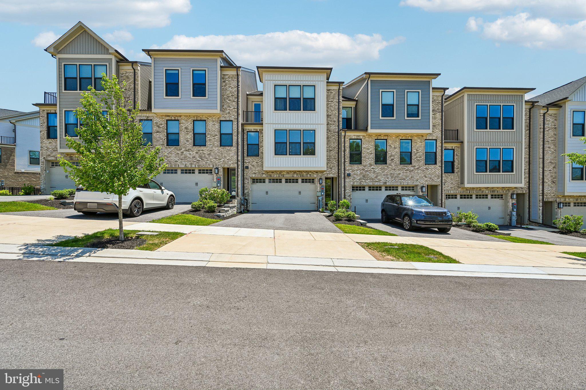 Welcome to 13719 Hunt Valley Court, a simply gorgeous luxury garage townhome in the highly sought-after Longview Ridge community. Perfectly positioned on a premium lot with breathtaking views and maximum privacy, this stunning 2023-built home offers over $50,000 in upgrades and combines elegant design with modern convenience.

From the moment you enter, you'll be impressed by the abundance of natural light, soaring ceilings, LED recessed lighting, and an open-concept floor plan designed for today's lifestyle. The heart of the home is the spectacular chef's kitchen, featuring a massive center island, custom tile backsplash, stainless steel appliances, designer range hood, and exceptional finishes throughout. The adjoining living and dining areas flow seamlessly to a truly unique enclosed terrace complete with a striking stone accent wall and built-in gas fireplace, creating the perfect space for year-round entertaining and relaxation.

Upstairs, the luxurious owner's suite features a tray ceiling, spacious walk-in closet, and a spa-inspired en-suite bath with a double vanity, custom tiled shower, and private water closet. Three additional bedrooms, two full baths, and two half baths provide plenty of room for family and guests.

The finished lower level offers incredible versatility with a spacious family room featuring soaring ceilings, ideal for movie nights, a home office, fitness space, additional entertaining or a bedroom. A two-car garage and private driveway provide ample parking and convenience.

Located just minutes from Hunt Valley Towne Centre, enjoy easy access to Wegmans, upscale shopping, restaurants, fitness centers, entertainment, and some of the area's premier country clubs. With quick access to I-83, beautiful Greenspring Valley nearby, and top-rated schools, this exceptional home delivers luxury townhome living at its finest in one of Baltimore County's most desirable communities.