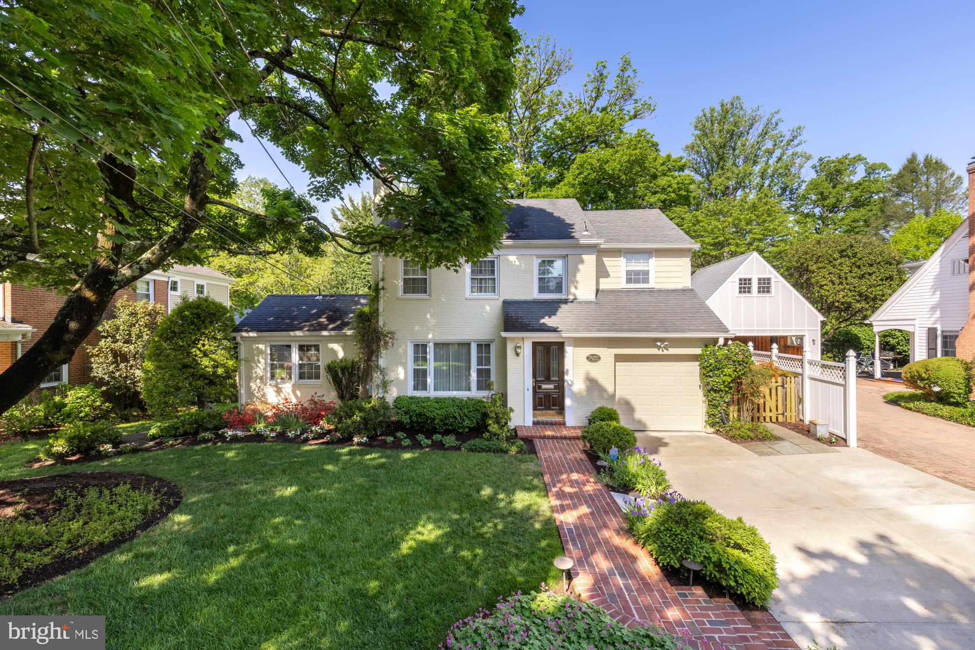 **Price improved + Sellers are now offering a $10,000 credit towards the buyers closings costs on a offer ratified on or before July 31st on this storybook expanded colonial steps to all that Downtown Bethesda has to offer!** ..Nestled in Wheatley Hills — one of close-in Bethesda's most established and sought-after enclaves, adjacent to prestigious Edgemoor and beloved Battery Park — this picture-perfect colonial is offered for sale for the first time in over half a century. Thoughtfully expanded across three generations of additions, 7822 Moorland Lane delivers the rare combination of timeless charm, genuine character, and walk-to-everything convenience that defines the best of close-in Bethesda living. <br>
Beautifully sited on a gorgeous, tree-lined lot with mature gardens in full bloom, the home's curb appeal is immediate and undeniable. Inside, the layout is both gracious and effortlessly functional. A large, sun-filled living room anchors the main level alongside a formal dining room with views overlooking the rear gardens. The family room and breakfast nook offer relaxed everyday comfort, while a separate den with an adjacent full bath provides true flex functionality as a guest suite, home office, or au pair retreat.<br>
The kitchen boasts custom cabinetry, top-of-the-line stainless appliances, and rich silestone quartz countertops — designed for serious cooking and effortless entertaining. All four generously sized bedrooms are privately situated upstairs, with the primary suite anchored by a  grey-toned "marble veined"  ceramic bath. The attached garage is EV-ready, and a large driveway provides additonal off-street parking — a genuine luxury in close-in Bethesda. Downstairs the unfinished basement has a plumbed quarter bath and is ready for your further touches or serves as additional storage or a workout room. Tucked into the rear of the property, a screened "tiny house gazebo" delivers the shaded outdoor sanctuary just in time for your Summer gatherings! And indoors the updated 2 zone HVAC with Enviro Air ultra-filtration are in place to keep you cool, while a whole-house generator is in place for any inclement weather. <br>
But it's the location that  is simply unmatched! Steps from Downtown Bethesda and the vibrant open-air scene at Bethesda Row,  Michelin-rated restaurants like Ala for dining, Retail options like the Apple Store or Marine Layer, and the Landmark Theatre for independent film., and in the bounds for Bradley Hills Elementary, Pyle Middle, and Walt Whitman High School. <br>
Prestige, proximity, and a home cherished for generations. 7822 Moorland Lane is ready for its next chapter.