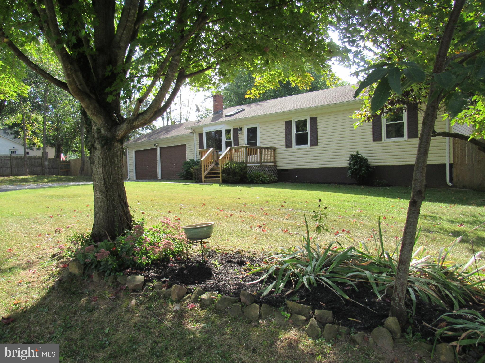 Home is like new located on a cul-de-sac for privacy. New kitchen, flooring, ceiling fans, recessed LED lights, bathrooms and new decking front and rear. 3 bedrooms, 2 full baths, new sliding glass doors lead to rear deck and fenced yard, front loading washer and dryer.  2 car garage with openers, bay window, freshly painted and newer heat pump.  This home is a must see!